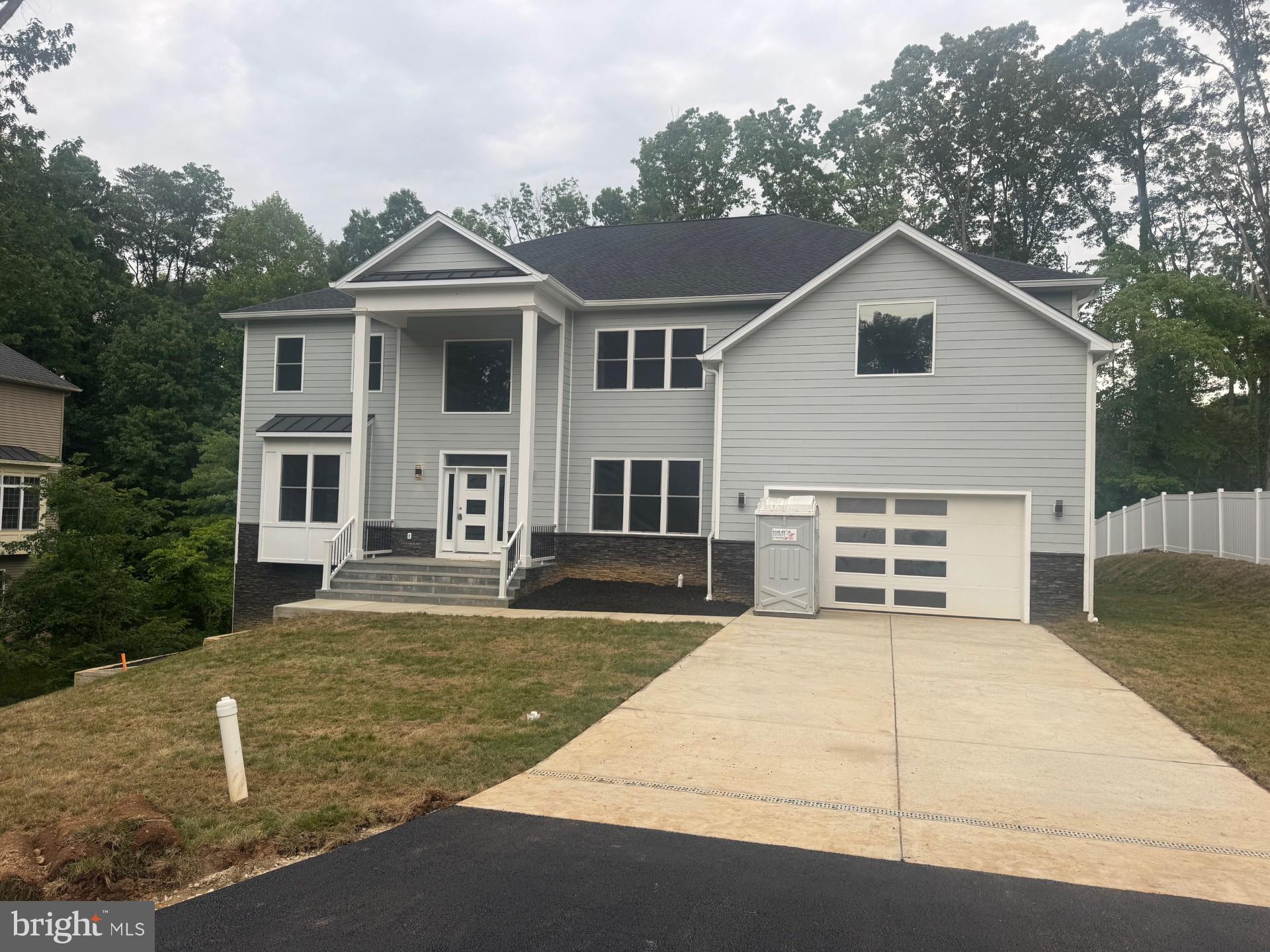 Newly Constructed – Elegant, Luxurious, Beautiful – Almost Ready for Occupancy in 30-45 Days Exterior work is being completed, and the house is ready for showings. Bring your clients to this beautifully built, brand-new home. Commuter's Dream! This stunning three-level, nearly 7,000 sq. ft. colonial is located close to the Franconia Metro Station and features 6 bedrooms, 5 full baths, and two powder rooms on the main level and basement. The fully finished basement offers additional living space. The main level includes a bedroom with an attached full bath, which can also be used as a library. The beautiful kitchen is equipped with upgraded appliances, a large pantry, and upgraded cabinetry. A butler's pantry is conveniently located next to the formal dining room. A deck will be built off the morning room, providing a perfect spot to enjoy the open backyard. The master suite includes a sitting room with a fireplace and a luxurious bath. This home boasts many custom features, including upgraded hardwood flooring on the main level, extensive trim work throughout, and pre-installed EV outlets in the garage. With its very open floor plan, this home is definitely worth the wait.