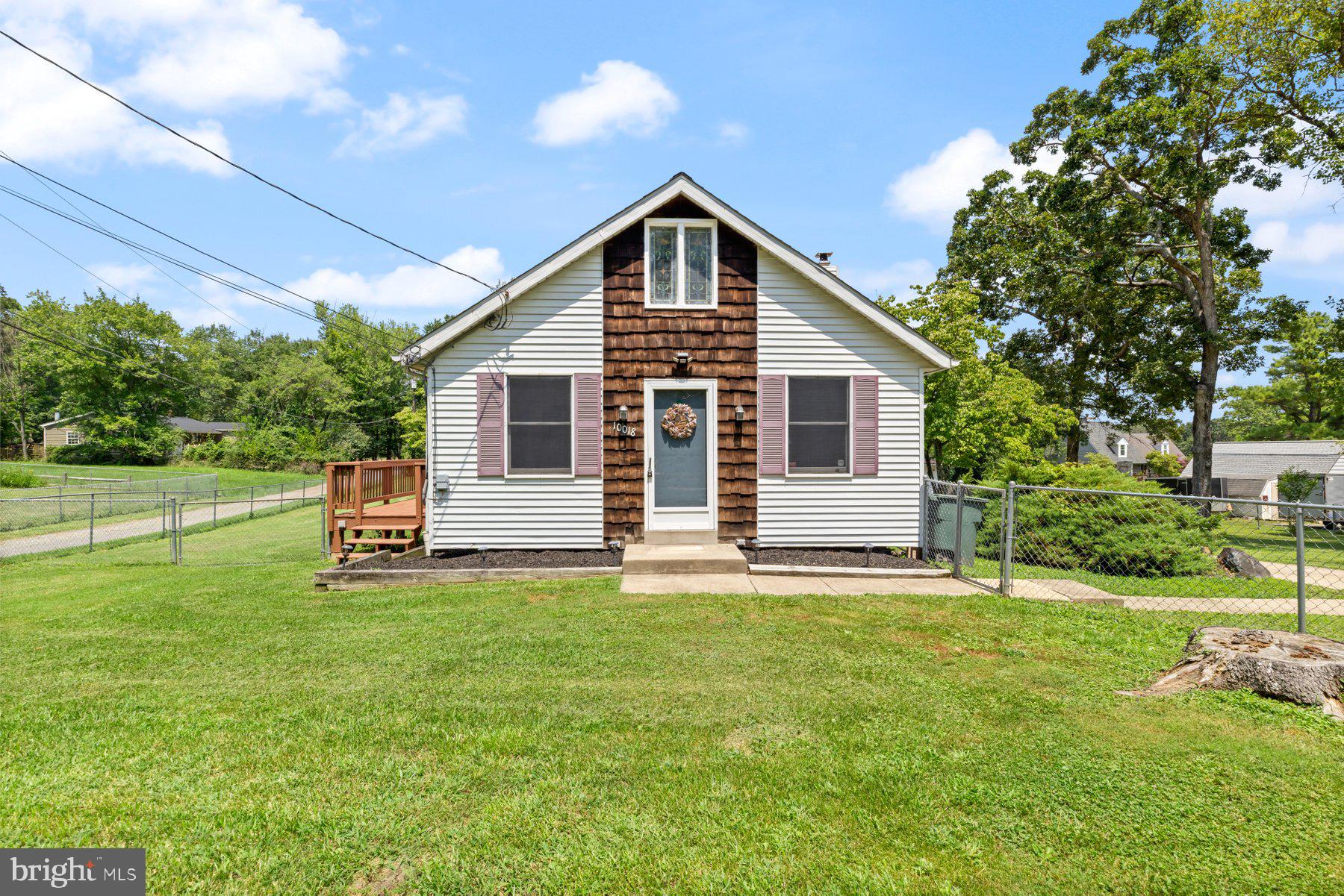 *******OFFER RECEIVED. OFFER DEADLINE IS MONDAY 7/28 AT 12PM. Adorable, move-in ready 2BR/1.5BA home located on a spectacular lot in a quiet neighborhood. Drive into the extra long driveway on the way to the front door of your new home. Step inside a home filled with tons of character, an open floor plan, vaulted ceilings with wood beams, and plenty of natural light. The main living space offers a large living room with a two-sided wood burning fireplace encased in a stone facade with a wrap around wood mantel, a spacious dining area, and kitchen. The modern style kitchen features plenty of sleek white cabinets and counter space, an electric cooktop and wall oven, and a double stainless sink under a window. Down the hall is a sizable secondary bedroom, a spacious primary bedroom with double closets, and a full bath. On the second floor is a potential third bedroom or office, hidden storage, and a half bath. The lower level is partially finished boasting plenty of room for the entire family to enjoy and a walkout basement. Step outside to an amazing wrap-around deck that overlooks the pristinely maintained fenced yard featuring a fire pit surrounded by well maintained landscape beds, a detached two-plus car garage with work benches and shelving, tons of green space and adult trees. This home is move-in ready with so much to offer any new homeowner and is located in proximity to shopping, restaurants, and commuter routes.