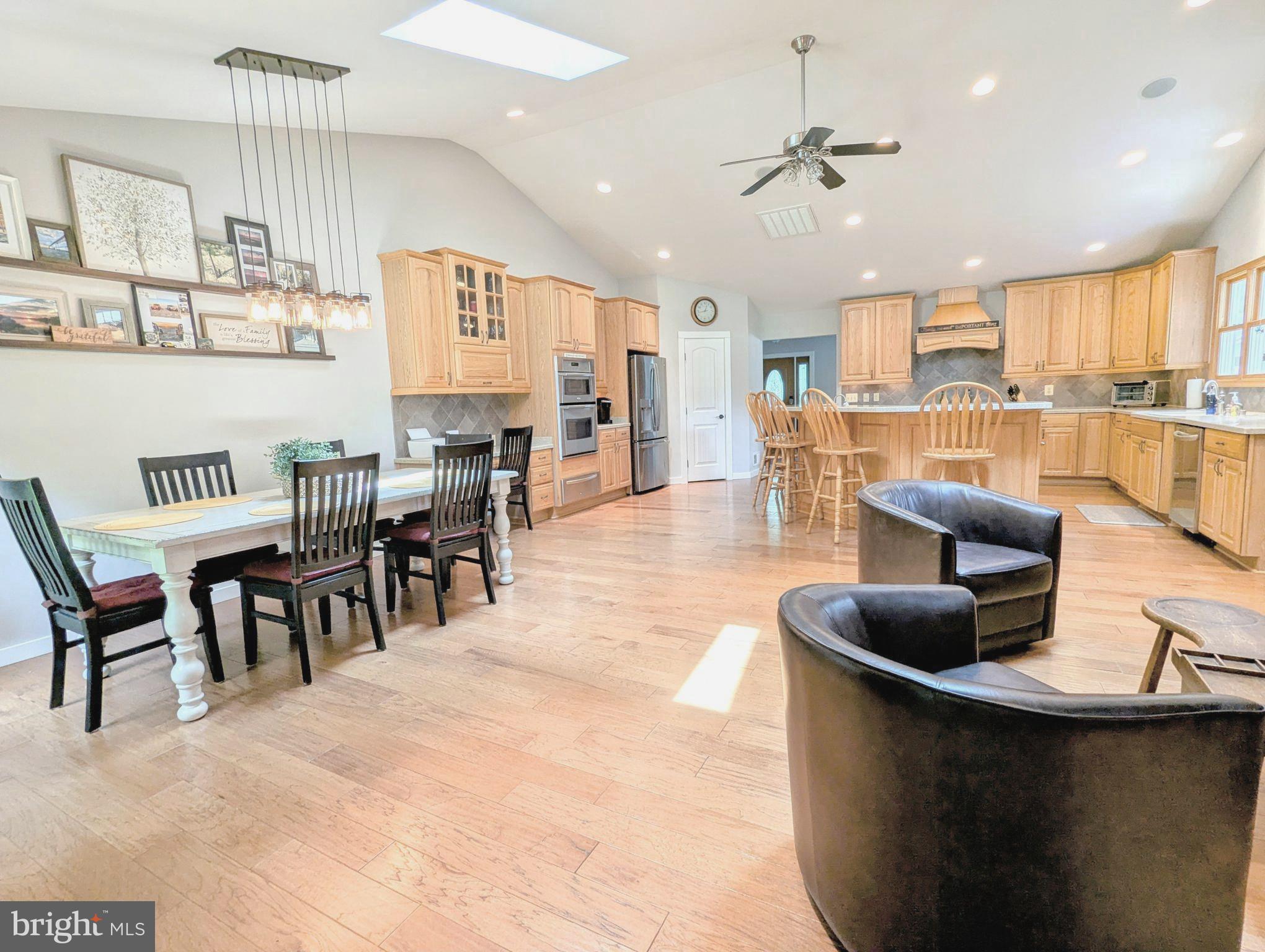 OPEN HOUSES, Sat. 9/13, 11am-1pm & Sun. 9/14, 12-2pm...Arguably one of the most stunning homes in Cloverfields! This beautifully expanded 3,268 sq ft residence features a breathtaking custom kitchen addition that’s tailor-made for family gatherings and entertaining. With over 600 sq ft of thoughtfully designed space, you'll enjoy vaulted ceilings, skylights, a spacious dining, and a stacked-stone fireplace in the cozy sitting area.
The kitchen is a true showstopper—complete with hardwood floors and a massive island perfect for bar stools, wall oven, six-burner cooktop, dishwasher, microwave, and upgraded refrigerator. No detail has been overlooked: custom spice racks, double trash pull-out, built-in recycling center, warming drawer, as well as a 2nd "prep sink," whole house & exterior sound system w/individual room controls, and more—all designed to enhance your daily living and culinary experience. Conveniently located off the kitchen is a mudroom featuring a second refrigerator, half bath, and stylish barn-door storage, adding both function and flair.
And that’s not all… Step onto the welcoming covered front porch and into a spacious living room that sets the tone for the rest of this beautifully designed home. Just a few steps down, you'll find a generously sized family room complete with a fireplace, stylish bar for entertaining, and two comfortable bedrooms—perfect for guests, teens, or multi-generational living.
A few steps up from the main level leads you to two additional roomy bedrooms and the luxurious primary suite. The primary bedroom offers a peaceful retreat, while the new en-suite bath features stylish finishes and thoughtful touches. You'll also find a brand-new laundry room conveniently located on this level. All five bedrooms are equipped with walk-in closets, providing abundant storage. Custom bath cabinets and closets include built-in outlets, keeping cords neatly tucked away while your devices charge.
Additional upgrades include a new 80-gallon water heater and an advanced HVAC system with damper-control thermostat for efficient, customizable comfort throughout the home. This home is more than move-in ready—it's a thoughtfully curated space where every feature was designed with comfort, convenience, and lifestyle in mind.