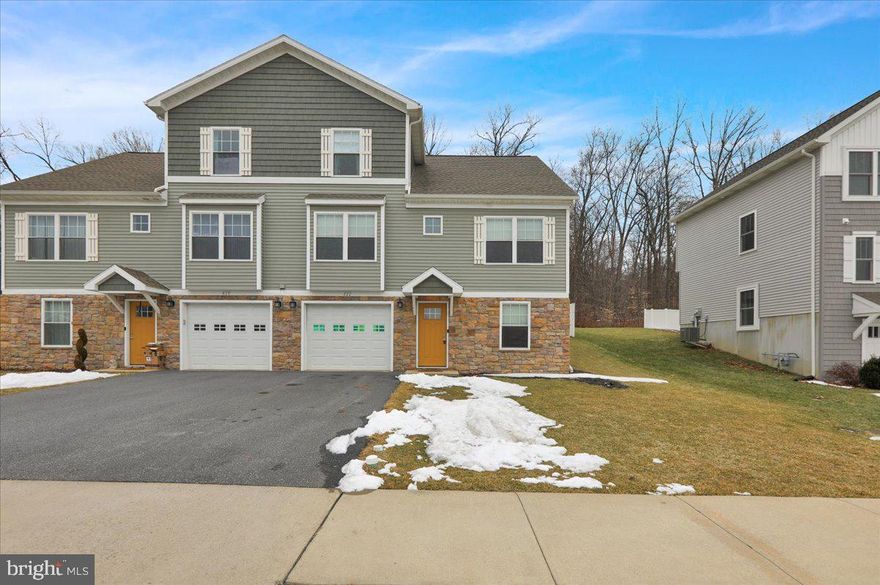 Welcome to this six-year-old twin home located in the heart of Robesonia. Conrad Weiser Schools, close to many amenities and highway travel. Additionally, this home boasts a rear deck, shed and vinyl fenced yard. Lowest level was recently finished to create additional entertainment/living space. The front entrance garage and off-street parking provide convenience for living. The living room and kitchen are part of the main open floor plan complimented by an electric fireplace and vaulted ceilings. The kitchen is spacious has an island and upgraded solid surfaces. The master bedroom sits just off the living room and boasts a double sink vanity master bathroom.  Additionally, there are two bedrooms on the upper level and one bathroom.  Home has neutral decor throughout and planked floors. Call to set up a tour today. House plans available upon request.
