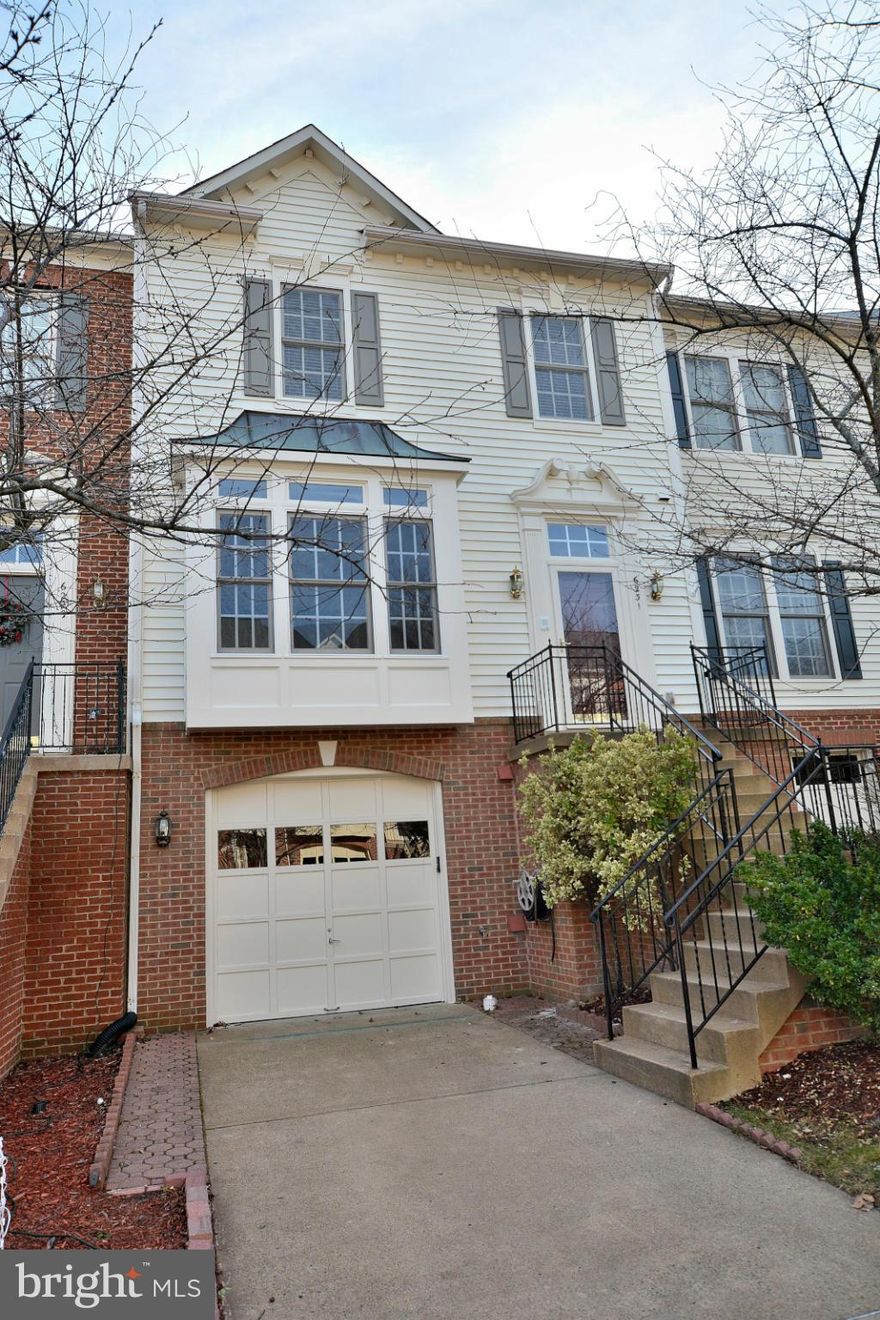 Gorgeous garage TH in super location awaits!  Not to be missed   seller has done the heavy lifting   New Kitchen w/upgraded cabinets/granite/stainless appliances/glass tile back splash/porcelain floor.  New hardwoods & carpet, MBA has been Remodeled too!  HVAC New/exterior painted October 2016.  Clean as a whistle & move in ready.  Community shuttle to Metro/VRE or walk lighted path to station.