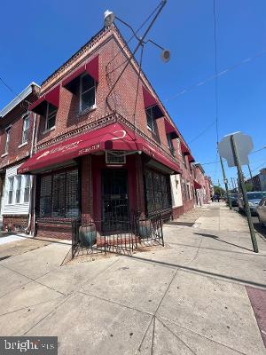 This amazing prime location mixed use corner is the one you have been waiting for! Previously a Flower shop, 1st floor Commercial features beautiful tin ceiling! also has 1/2 bath with large basement access, multiple rooms & 2 large Refrigerators. Possibly with this size can get permit/zoning for 3 units?! Note, per deed back rear room was previously a garage and possibly could be converted/ permitted back to garage. 2nd floor is a very large 2 bedroom apartment with a deck. Large open L/R - Kitchen concept and a nice size full bath. 2 bedrooms are freshly painted with lots of natural sunlight. *Property being sold AS/IS. Inspections welcome but only for Buyers due diligence.