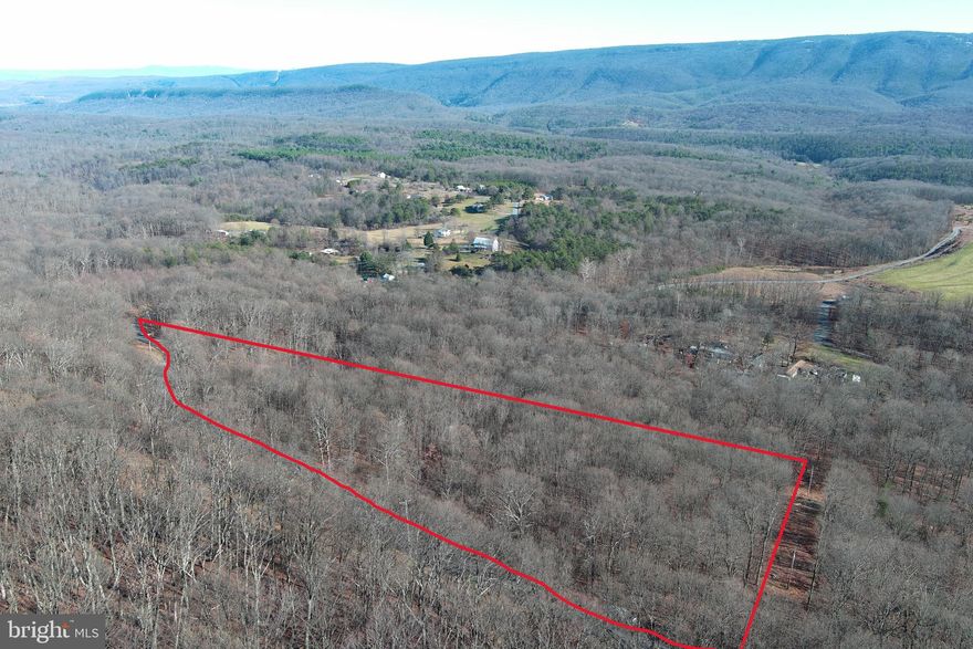 EASY MOUNTAIN BLISS....NEARLY 6 UNRESTRICTED ACRES ELEVATED AT 1200 FT WITH LONG RANGE VIEWS, GENTLE TOPO AND EASY ACCESS WITH DIRECT PAVED ROAD FRONTAGE. PROPERTIES WITH VIEWS THIS GOOD TYPICALLY REQUIRE SEVERAL MILES OF TRAVEL ON WINDY DIRT ROADS, NOT THIS ONE! JUST INSTALL YOUR DRIVEWAY OFF THE PAVED ROAD INTO THE HEART OF THE PROPERTY FOR PRIVACY AND EASY ACCESS, ELECTRIC ALONG PROPERTY BOUNDARY JUST A FEW HUNDRED FEET FROM THE IDEAL BUILDING SITE. GENTLE TOPO FOR A MOUNTAIN PROPERTY AND COVERED IN HARDWOODS, IDEAL FOR A FULL TIME OR WEEKEND HOME. NO RESTRICTIONS + NO HOA = NO PROBLEMS......BUILD WHAT YOU WANT....DO WHAT YOU WANT....YOU MAKE THE RULES! OUT OF THE WAY BUT CLOSE TO EVERYTHING....10 MINUTES FROM POTOMAC & CACAPON RIVER ACCESS, 12 MINUTES FROM SIDELING MOUNTAIN WILDLIFE MANAGEMENT AREA(1500 acres of public hunting) 15 MINUTES FROM HISTORIC BERKELEY SPRINGS, 20 MINUTES FROM CACAPON STATE PARK & RESORT FOR GOLF & TROUT FISHING. THIS RECREATIONAL OASIS IS ONLY 2 HOURS FROM DOWNTOWN DC.....IT'S TIME TO TAKE A DRIVE AND FIND OUT WHY THEY CALL WV "ALMOST HEAVEN"