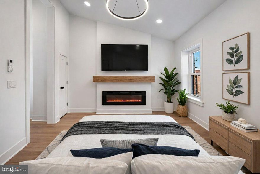 Now offered at $564,000.

Welcome to 714 Earp St, a fully renovated, professionally permitted residence rebuilt in 2026, offering 4 bedrooms and 3.5 bathrooms with an APPROVED 10-YEAR TAX ABATEMENT, located in the heart of Passyunk Square, just blocks from East Passyunk Avenue, one of Philadelphia’s most vibrant dining and shopping corridors.

Thoughtfully redesigned with premium finishes throughout, the home’s centerpiece is a true primary suite occupying the entire third level—delivering a private top-floor retreat rarely found within comparable South Philadelphia homes. This level features a striking vaulted ceiling approaching 12 feet in height, an elegant electric fireplace with custom mantle, a spa-inspired primary bathroom with a luxury walk-in shower and 60-inch double-sink vanity, expansive custom closets, and a dedicated mini-split system providing independent heating and cooling for the entire floor.

This residence was taken down to the studs and comprehensively rebuilt, featuring a brand-new roof and all-new plumbing, electrical, and HVAC systems — all completed under permit to provide lasting quality and peace of mind.

The main level emphasizes both function and flexibility, blending open living space with a rare first-floor bedroom and full bath — ideal for guests, a private office, or adaptable dining and everyday living.

The second floor offers two generously sized bedrooms with wide closets, a beautifully finished full bathroom with tub, and a dedicated laundry room with utility sink. The finished basement—modest in size yet highly functional—provides excellent storage and a convenient half bath.

The kitchen is outfitted with shaker-style cabinetry, quartz countertops, a custom vent hood, LG appliances, a pot filler, garbage disposal, and a workstation sink — seamlessly blending elevated design with everyday functionality.

Additional features include wide-plank luxury vinyl flooring throughout, Nest smart thermostats, 200-amp electrical service, multiple HVAC zones, a high-efficiency A. O. Smith Signature 300 smart electric water heater with leak detection, a Ring camera system, and all appliances included for turnkey living.

Enjoy exceptional walkability to award-winning restaurants, cafés, boutique shops, the Italian Market, and East Passyunk Avenue—making this home the ideal blend of refined living and premier urban convenience.

Seller is a licensed real estate agent in the Commonwealth of Pennsylvania.