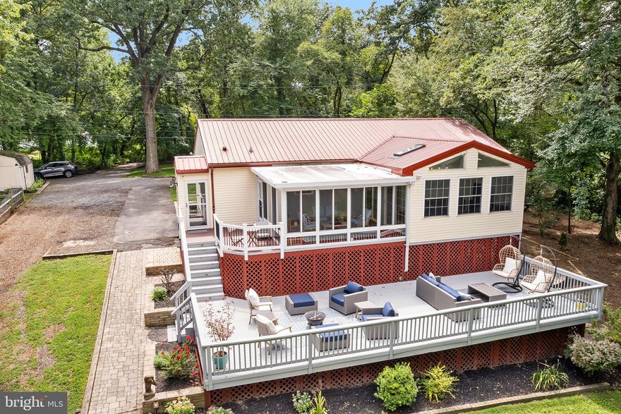 This exquisite waterfront property is a true oasis of tranquility, nestled on nearly an acre of land, with breathtaking views of the picturesque Furnace Creek. The captivating features of this home include a beautiful beachfront area, an expansive 110-foot private pier with a water depth of 8+ feet, and a range of top-notch amenities designed to enhance your waterfront experience. The interior of the home is designed to offer both comfort and entertainment, with a spacious great room that seamlessly connects various living spaces. The elegant hardwood floors, custom cabinetry, and stylish granite countertops create a luxurious atmosphere. The modern kitchen is equipped with high-end appliances, ensuring a delightful culinary experience. Convenience is a hallmark of this home, with a practical mud room for storage and organization. The dining room leads to a cozy seating area, perfect for relaxation, and the sunroom provides a serene retreat with access to the deck, allowing you to immerse yourself in the stunning waterfront views. The main floor features three bedrooms, providing ample space for family and guests. The primary suite, thoughtfully located on the main floor, includes an ensuite bathroom, offering a private sanctuary. The walk-out lower level is versatile, suitable for various purposes. It offers a spacious living room and two additional rooms that can be used as extra bedrooms or office space, catering to your specific needs. The outdoor amenities truly set this property apart, with a gazebo featuring a large deck overlooking the water, an inviting fire pit on the bluff, and comfortable seating areas on the private pier. The landscaping is meticulously designed to complement the natural beauty of the surroundings. Electricity is available throughout the property, including the gazebo and boating supply shed, and the pier offers 5 boat slips for your convenience. For those who value storage and workspace, this home provides a two-car detached garage with a dedicated workspace, as well as an additional one-car garage for extra storage needs. To ensure your comfort and peace of mind, the roof was replaced less than 5 years ago, and a new Trane system was installed less than a year ago, ensuring modern efficiency and reliability. In summary, this private waterfront gem offers a perfect blend of natural beauty, functional living spaces, and impressive waterfront amenities, making it an ideal retreat for those seeking a serene and luxurious waterfront lifestyle. There is a shared driveway easement. Voluntary HOA