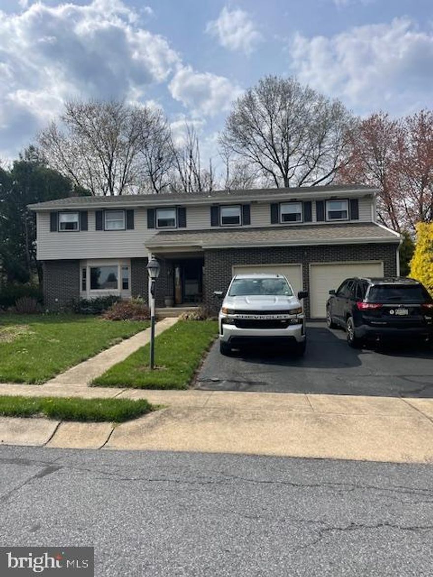 Custom built in the 70's and expanded in the early 80's to accomodate  in-law living; this home has plenty of room to gather large families and groups of friends.  The traditional layout features a formal living room with bay window and fireplace.  From there, step into the dining room with hardwood floors and crystal chandelier.  The kitchen was featured in a magazine when built for its custom design, it has upgraded countertops, double sink, gas cooking and storage galore.  The family room just off the kitchen has a beautiful brick focal wall with gas fireplace.  A powder room and separate laundry room with sink and closets complete the main level.  You'll find 4 bedrooms and two baths to one side of the second floor and two bedroom and full bath to the other side of the second level.  An office or (7th) bedroom is between them all.  The expansion created the addl space on the second floor complete with its own heating and cooling system; can be a full in-law suite.  The basement is unfinished; great storage with Bilco access to rear yard.  The yard is surrounded by arborvitae and mature landscape.