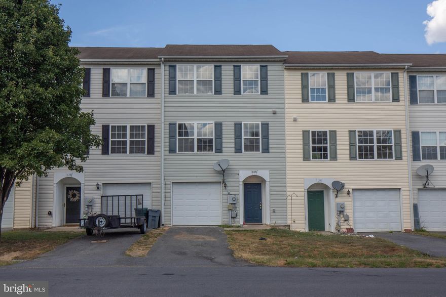 You're welcomed into the home through the lower level - a finished walk-out with access to the one car garage, possible additional bedroom or office, and full sized washer and dryer.

As you go upstairs to the main level you will be greeted by the naturally lit open floor plan with living room, additional half bath, and combination kitchen/dining room that has a slider door giving access to the rear deck that overlooks a wooded area and the unfenced rear yard - perfect for relaxing, fresh air, or outside entertaining!

The upper level also has the primary suite with full bath and two closets, additional full bath, and two bedrooms.

The Mills Farm Community offers residence tot lots, playground, and is conveniently located between Martinsburg and Inwood for easy access to commuter routes 11 and I-81.

Pets are on a case-by-case basis.

Additional monthly costs include Renter's insurance (price based on plan selection) and Second Nature Air Filter Subscription program ($15.00/ month).

EHO.