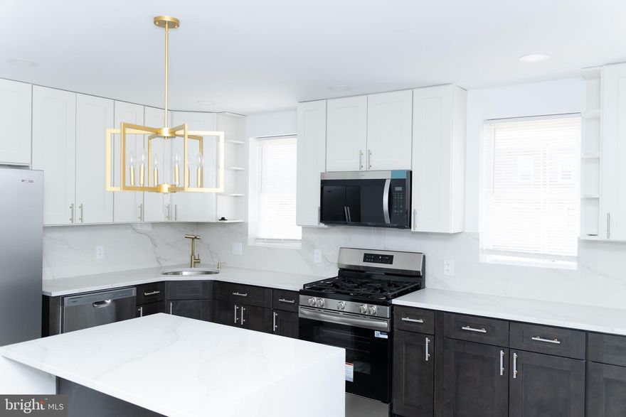 Stunning Fully Renovated 3 Bedroom, 2.5 Bath Brick Home with Finished Basement & Modern Touches Throughout.

Welcome to 6306 - where bright natural light, clean lines, and thoughtful design come together seamlessly. The open-concept main level features sleek, wide‑plank flooring, recessed lighting, and a contemporary layout. The stunning chef’s kitchen stands at the heart of the home, showcasing two‑tone cabinetry, gleaming quartz countertops, a spacious island, stainless steel appliances, and striking gold accents that add a touch of luxury. 
Upstairs, the home continues to impress with generously sized rooms and a sophisticated full bath adorned with floor‑to‑ceiling marble‑style tile, a frameless glass shower, and premium fixtures. Every detail has been carefully curated - modern railings, upgraded doors and hardware, fresh paint, and stylish lighting throughout. The bathrooms are true retreats, featuring luxury tile work, frameless glass shower doors, and brushed‑gold fixtures that exude elegance. The striking marble‑style wall tiles in the ensuite and hall baths make every shower feel like a spa experience. 
The finished basement adds valuable living space, perfect for a family room, guest suite, or home office. Behind the scenes, you’ll appreciate the brand‑new mechanical systems, including a Goodman HVAC system, updated plumbing, and efficient electrical systems, ensuring worry‑free living for years to come. Outside, enjoy a maintenance‑free brick exterior, a private driveway, and a garage offering both parking and storage.

This property combines exceptional design, modern amenities, and timeless comfort in every inch. Everything in this home radiates freshness and quality, where all the hard work has already been done. Move in, unpack, and enjoy. Schedule your showing today and fall in love with this stunning transformation!