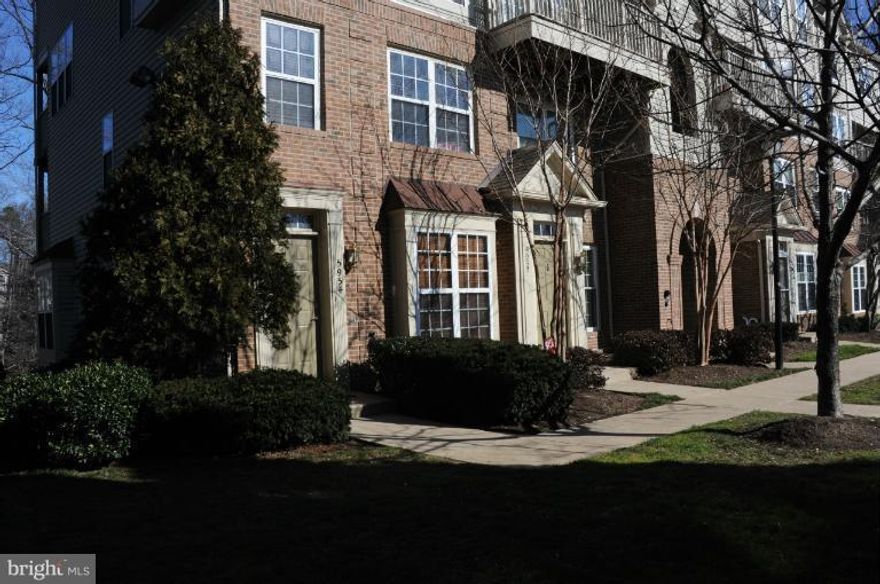 LOCATION! 5K PRICE REDUCTION Beautiful brick-front, end-unit TH style condo backing to trees. Deck off LR and master BR offering tons of privacy. HW in foyer and kit. Eat-in kIitchen w/ & bay window. 42" white cabinets w/ granite counter tops.BRAND NEW S/S APPLIANCES. Gas fireplace and marble surround. Sliding glass door to deck. Master BR w deck, walk-in closet, New taupe paint main level