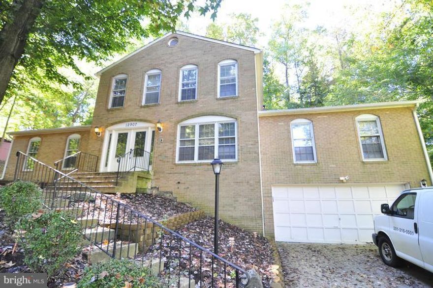 Just under 3,000 sq ft! This 2-car garage, brick front colonial boasts hard wood floors, potential 1st flr bedroom with custom wall 2 wall closet, FP ,eat in kitchen,New Hot water tank, New Furnace,New Sump pump, and new ss appliance. Owners suite offers  sitting area, spa bath and walk-in closet. Finally, the basement is perfect for entertaining with recessed lighting, custom bar, and full bath.