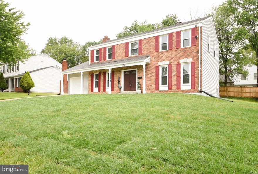 Back to Active Status!  Now is your chance! Welcome to this beautifully maintained 4-bedroom, 2.5-bath Colonial nestled in the sought-after, established community of Woodlark. Thoughtfully upgraded and lovingly cared for, this charming home offers both comfort and function.

The brick-front exterior adds timeless curb appeal, while inside you’ll find fresh paint, new carpeting, and updated flooring throughout. The main level features a convenient laundry room and an upgraded one-car garage complete with built-in shelving for ample storage. NEW 2025 - garbage disposal.

Upstairs, the updated hall bathroom includes thoughtful touches like a grab bar and built-in shower seat. The spacious primary bedroom offers built-in shelving and a generous walk-in closet.

The lower-level recreation room is ideal for entertaining. Freshly painted, new flooring, a waterproofing system, NEW 2025 water heater and sump pump w/battery back up. Recessed lighting for a bright, welcoming feel.

Enjoy cozy evenings by the wood-burning fireplace in the family room, and appreciate the peace of mind that comes with major upgrades including a new sewer line,  professionally graded yard with new sod and a 2/10 Home Warranty. Roof/siding replaced 2017. Fireplace "As Is" seller has never used.