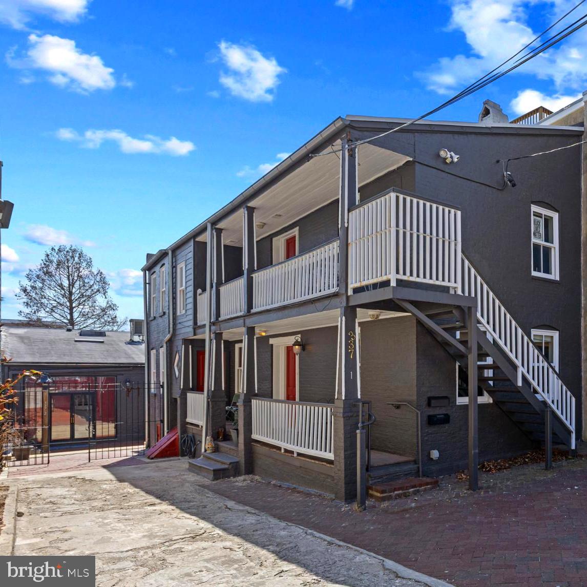 Historic Landmark in Federal Hill –
Rarely does a property of this historical significance and character become available in the heart of Federal Hill. Located on "The Hill," 337 E Hamburg Street is a true landmark, once home to General Butler during the Civil War. This unique property offers two distinct residences, making it an ideal opportunity for an owner-occupant, investor, or multi-generational living.
The main house, built in 1790, exudes charm and historic elegance. Featuring two bedrooms and one and a half baths, this home is filled with original details, including a wooden ceiling in the dining room, a tin ceiling in the kitchen, and a decorative fireplace. The inviting living and dining spaces create a cozy and intimate atmosphere, while the eat-in kitchen adds to the home's functionality. Two porches offer additional outdoor living space, perfect for relaxing or entertaining. A small basement, which once housed prisoners during the Civil War, adds a fascinating historical touch to the home’s already rich character.
The second residence ( For Rent ), a former barn that was converted years ago, offers an incredible living space with soaring 22-foot ceilings, exposed beams, and stunning stained glass accents. This home, fronting Grindle Street, boasts three spacious bedrooms and two full baths. The massive living room and open-concept kitchen create a dramatic and inviting space, ideal for entertaining. Additional rooms provide flexibility for a home office, playroom, or even an extra bedroom. A charming front porch completes the picture, offering a welcoming entrance to this one-of-a-kind residence.
Located in the sought-after Federal Hill neighborhood, this property is just minutes from the Inner Harbor, Baltimore Aquarium, Oriole Park at Camden Yards, M&T Bank Stadium, and major commuter routes, including I-95. With its blend of historic charm, unique architecture, and unbeatable location, this is a rare opportunity to own a truly special property in one of Baltimore’s most vibrant communities. Don’t miss your chance to experience the character and history of this incredible home—schedule your private showing today! Don't forget there is parking for 4 vehicles!!!