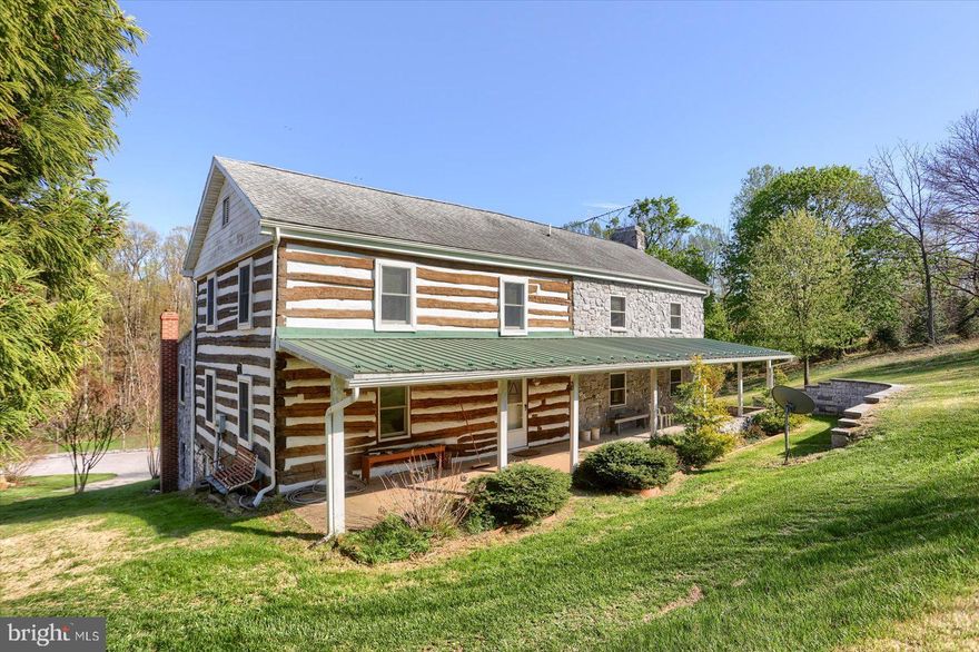 The perfect homestead awaits you! This stunning 30+ acre property offers peace, privacy, and versatility and is just minutes from Shrewsbury and I-83. With approximately 13 tillable acres, a spring-fed water source, and beautiful wooded surroundings, this is a rare opportunity to enjoy country living with modern conveniences.

The home features 3 bedrooms, 3 full baths, and 1 half bath—including a spacious primary suite with a full bath and walk-in closet. The original side of the home showcases charming exposed log construction, while the large addition offers a bright, open family room with radiant heated floors and zoned heating for maximum comfort. Warm up by the wood-burning fireplace in the family room or gather around the cozy wood stove in the dining area. Central air adds to year-round comfort.

The walk-out lower level includes a full bath and plenty of room for additional living space—ideal for a guest suite, rec room, or hobby area.

Enjoy the views from two covered front balconies or unwind on the covered rear patio. The property also includes a 36' x 64' pole building and 20'x 32' barn/garage/workshop/ butcher shop, you decide!  Both outbuilds have electric. Whether you’re looking to homestead, farm, or simply relax and watch the deer wander by, this property offers the space and serenity to do it all.

The seller is offering a 1 year First American Home Warranty.