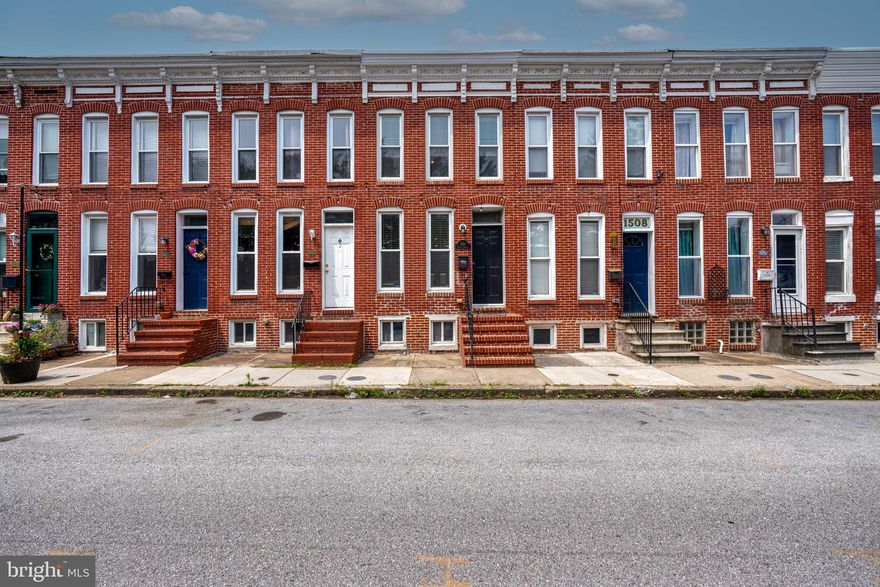 Charming and updated two bedroom, two full and one half bath home with off street parking in Riverside!  Come experience the convenience of city living with this cozy updated home.  Plenty of off street parking due to no homes on the opposite side of the street with an entrance located toward the end of the street that gives access to the Giant grocery store.  Walk into a open lay out with a half bath conveniently located on the main floor.  Large updated open kitchen leads to a spacious light filled dining area.  Bring in groceries with ease from rear door leading out to the parking pad with easy access due to large alleyway.  Downstairs you will find plenty of dry storage space!  Doing laundry is a breeze with washer/dryer located in the hallway on the second floor.  One full bath en suite located upstairs  located in  a bright bedroom facing the street.  At the rear of the second floor you will find a large master bath en suite in the master bedroom.  Access to the roof top deck is at the rear of the second floor with views of the city skyline including the iconic Domino's Sugars sign!  Come see me today and ask your agent about all the updates that the Sellers have done!