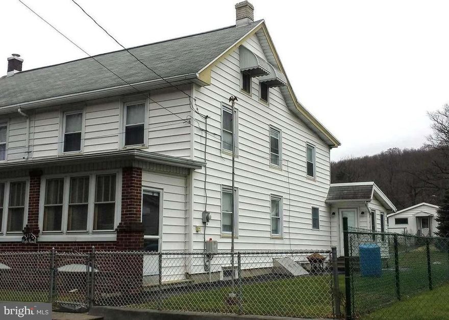 Investors.......Come check out this solid built four-bedroom 2 bath, semidetached home.  Perfect for a first-time homeowner with handyman skills.  Come personalize this blank canvas and make it your own.  Outside home is maintenance free with a nice size, fully fence yard and oversized two car garage in the rear.  Being sold as-is.