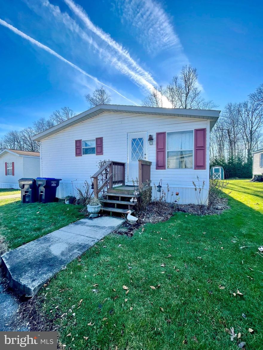 Located in the Octorara School District and situated on a nice lot, tucked away in Shady Grove MHP. This 3 Bed 2 Full Bath Double Wide home surrounded by farmland has updated flooring, newer roof & neutral paint throughout. Open concept with lots of Natural light, oversized kitchen with vaulted ceilings, island, stainless appliances and tons of cabinet space. Laundry area with washer/dryer included. Primary bedroom has its own private on suite.  Flat yard with storage shed. 2 Parking spaces included. Don’t miss your opportunity to own this exceptional home!