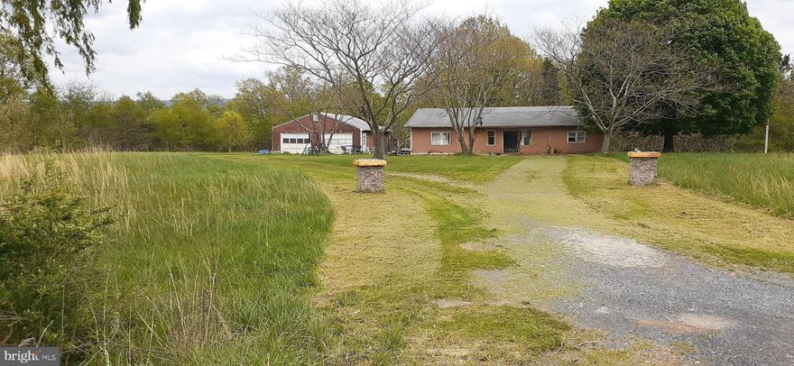 6.2 Acres of Pure Freedom – Wildlife, Water, & Endless Potential 
If you’ve been searching for a slice of unrestricted West Virginia land where nature thrives and possibilities are wide open, this 6.2-acre property delivers.
This beautiful parcel offers an ideal balance of open field and wooded privacy, creating the perfect setting for a homestead, hunting retreat, recreational getaway, or future build. Wildlife is abundant, and an almost year-round stream gently winds through the property, adding both charm and function.  Property has road frontage and has easy access with a circle driveway.
Enjoy established mulberry trees, blueberry bushes, paw paw trees, and wild berry bushes, making this land as productive as it is scenic.  
* Electricity already on site
* 376-foot deep well
* Detached 2-car garage boasts a concrete floor with water and electric, and an auto mechanic oil pit installed in the floor—a rare bonus for hobbyists or professionals.
There is a home structure on the property that is considered to have zero value and will require complete rehabilitation or removal. This is your opportunity to start fresh and design exactly what you want.
No covenants, no restrictions, no rights-of-way—true freedom to use the land your way.
* Property is being sold AS-IS, WHERE-IS
Whether you envision a private retreat, self-sufficient homestead, or investment opportunity, this property offers the land, utilities, and freedom to make it happen.
Opportunities like this don’t come along often—bring your vision and make it yours.