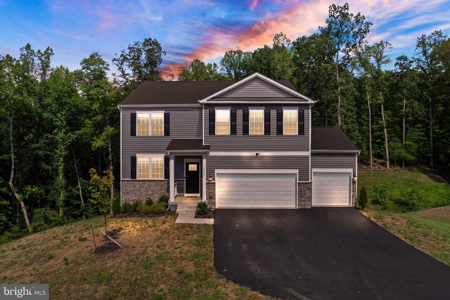 This like-new home will wow you from the moment you step in! Upon entering to the left is a carpeted flex space ideal for a home office or children's play area. Walk straight in to your open-concept floor plan with  chef's kitchen featuring granite countertops, stainless steel appliances,  an island with overhang for seating, ample cabinetry, and a large pantry. Directly next to the kitchen is a breakfast room with a sliding glass door leading you to your composite deck. In front of the kitchen is a large family room with lots of natural light soaring through. Completing the main level is a main-level bedroom and full bathroom, perfect for guests who want to avoid stairs. Directly upstairs, your large primary bedroom greets you with a  walk-in closet and a primary bath featuring dual-vanity sinks, stand-up shower and bath tub. Your laundry room is located next to the primary bedroom, making laundry day a breeze! Three other spacious bedrooms are located on this level and share a full bathroom with dual-vanity sinks and a stand-up shower. This level also features a loft space, perfect for a play area or cozy lounge. The basement is mostly finished, featuring a walk-out finished recreation room, a large storage room, and an unfinished space large enough to create a sixth legal bedroom with a rough-in for a full bathroom. The home includes 9' ceilings throughout with plenty of natural light soaring through, sits on over an acre land and is located in a culdesac with no-through streets. This community of Aquia Overlook is close-by to shopping centers, restaurants, and only 45 miles to DC, making it a great option for commuters!