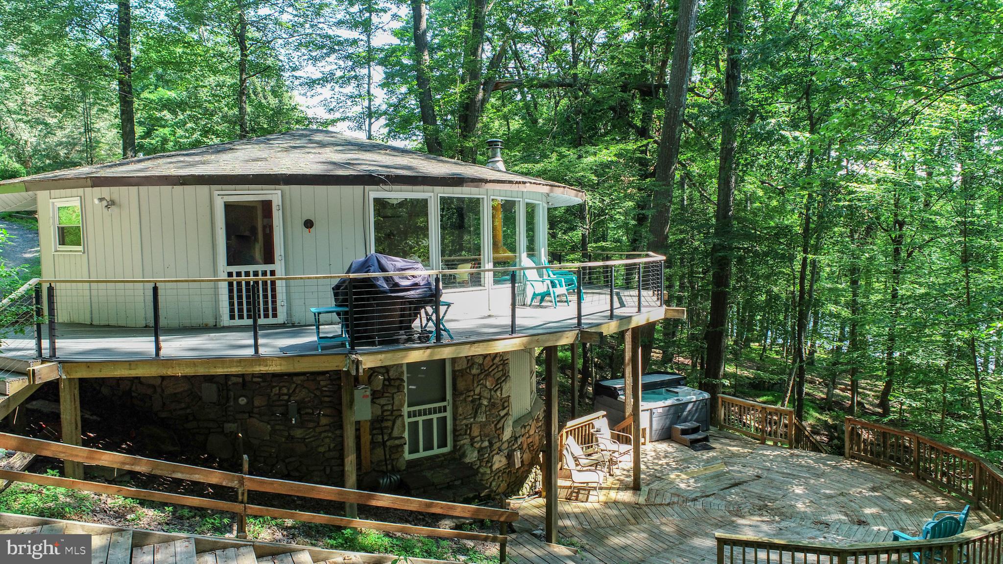 Vintage 3BR Lakefront Dome Home with Private Type "A" Dock! & no HOA . Own a piece of Deep Creek charm with this unique 3-bedroom, 2-bath vintage lakefront home featuring 100 feet of lake frontage and a private dock. The eye-catching dome-style architecture sets this property apart, offering a cozy and distinctive retreat. Located just minutes from Wisp Ski & Golf Resort and the ASCI Whitewater Course, it’s perfectly positioned for year-round adventure. Currently an established rental, this home offers both personal enjoyment and income potential. Don’t miss your chance to own a truly special lakefront getaway!
Schedule your showing today