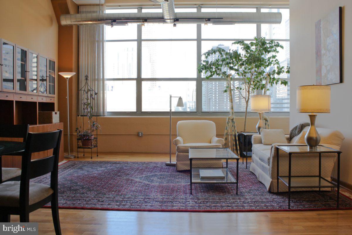 • 970 sqft split level studio • covered parking  • stunning view of center city skyline • granite counter tops with golden/brown tile backsplash • stainless steel kitchen appliances and over-sized sink • custom-made walk-in closet with wood cabinets and storage accessories  • Jacuzzi bathtub • plenty of cabinets in the bathroom • water filtration system with separate faucet • crawl space for storage  • Hunter Douglas window treatments (blinds/curtains)  • washer & dryer in unit  • hardwood floors • gym in building • convenience store in building  • 24 hour staffed front desk • low condo fees • fully occupied building with excellent condo board • fast elevators with service elevator • close to everything -- Rittenhouse square, museums, Schuylkill trail, UPenn & Drexel, Amtrak station ... The monthly condo fee is increasing 9% in January 2022 plus there will be a 3-month special assessment (3 x monthly HOA fee).