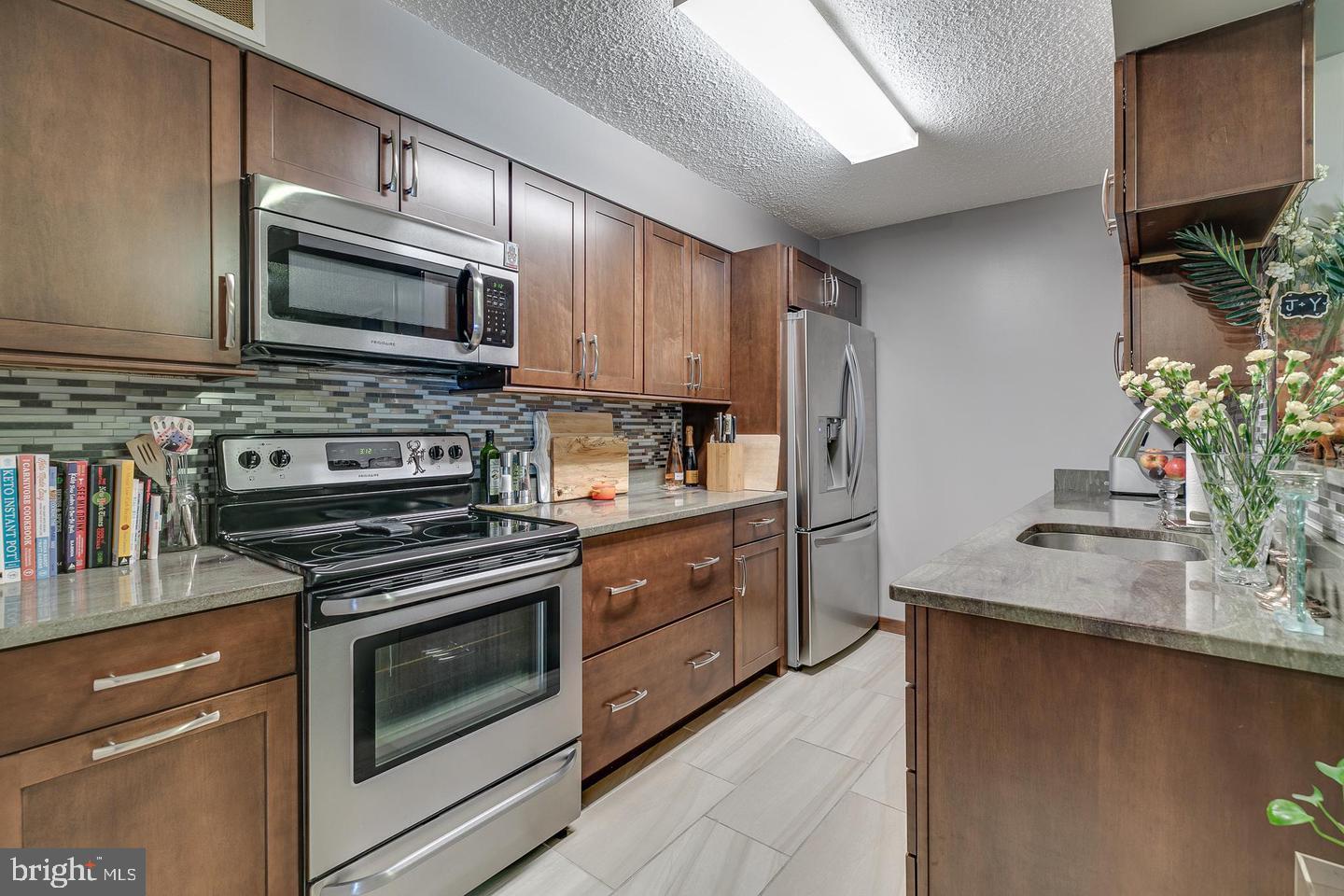 Explore this meticulously cared for 2-bedroom, 2-bathroom condo in the Academy House, right in the heart of Center City. Enjoy the convenience of being just steps away from Rittenhouse Square, the Kimmel Center, not to mention the countless dining, entertainment, and shopping options. The modern kitchen showcases granite countertops, stainless steel appliances, a mosaic backsplash, and plenty of storage. The open living and dining area flows out onto a large east-facing terrace, perfect for relaxing. The primary bedroom features an ensuite bathroom, a sizable walk-in closet, and direct access to the terrace. The unit also features a second spacious bedroom and full bathroom as well as a washer and dryer. Building amenities include a 24-hour doorman/concierge, a newly renovated lobby, a state-of-the-art fitness center, a sauna, and a pool. Located just steps from SEPTA and PATCO stations as well as easy access to the main highways. There is also an attached parking garage for a monthly fee. Rent Includes ALL utilities (except cable/internet) and use of all common amenities.