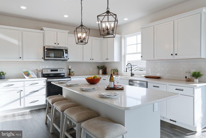 Woodbridge Homes is excited to offer this beautiful new home in Clear Spring.  This home offers over 3,200 sq ft of finished living space.  The main level offers LVP flooring throughout including a great kitchen with quartz countertops, large island, stainless steel appliances and more.  Relax in your cozy family room with your linear fireplace or step out onto your trex deck to enjoy a your morning coffee.  The upper level of the home is where you will find the primary suite with a walk-in shower, walk-in closets and much more.  The laundry room is located on the upper level making it very convenient. The lower level is a walk out level that is partially finished as well.  This home is currently under construction and will be ready for a January move in.