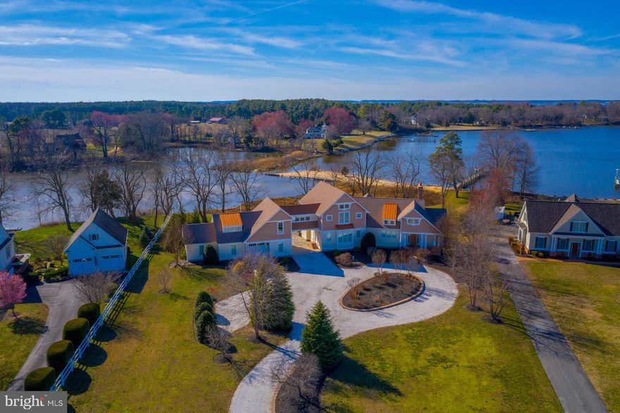 Breathtaking Waterfront Property located in a Secluded Cove with a Private Sandy Beach and Pier at the mouth of the Corsica River!  No expense was spared in this Truly Unique and Amazing 4700+ square foot property with 5 Bedrooms, 4 Full Bathrooms, 2 Half Bathroom & loaded with Natural Light.  Some of the many upgrades include White Oak Hardwood Floors, Open Gourmet Kitchen with Wolf Range and Marble Counter-tops,  Cathedral Ceilings, Main Level Master Suite with His and Hers En Suites, Expansive Water Views from Most Rooms, Geothermal HVAC System, Finished Basement and the list continues.  Easy access to waterway from rear garage to the  Private Beach and 100'  Pier with Boat Lift and 4 Jet Ski Lifts!  The Perfect Family Retreat awaits in this Stunning Waterfront Property - You will Never want to leave!  No Flood Insurance required.  Call today to schedule a Private Tour!