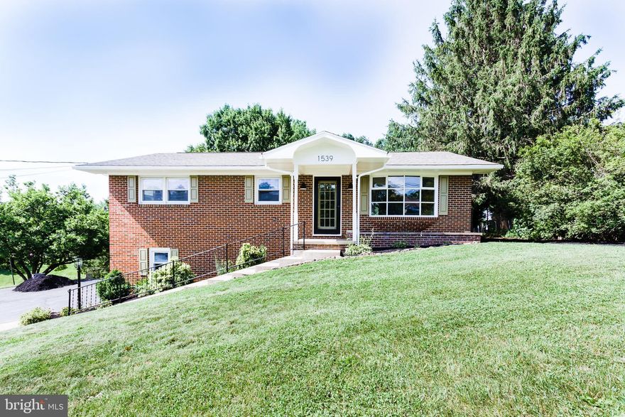 BEAUTIFULLY RENOVATED! This All Brick 3 bedroom 1.5 bath Raised Rancher features:  updated kitchen with granite counters & new stainless steel appliances; new luxury vinyl plank & carpet through out; new modern light fixtures; updated bathrooms with granite top & new vanity; lower level family room with fireplace/woodstove; built-in bookcases; over-sized two car garage; front porch, large rear deck; new mini-splits; storage shed; and so much more! Located in the lovely Pleasant View Development and setting on a fabulous lot with a great back yard & landscaping which includes a garden pond & landscape stone accents!