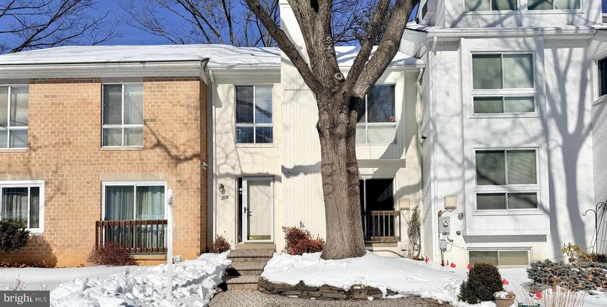 Welcome home to 7353 Broken Staff, a beautifully updated townhome in the heart of Columbia, Maryland; truly move-in ready and thoughtfully improved over the years.  This home offers the perfect blend of comfort, functionality, and location, complete with a FENCED BACKYARD ideal for pets, play, or relaxing outdoors.  Recent updates provide peace of mind and modern appeal, including fresh paint throughout most of the home (2026), a new range (2025), two new basement sliding glass doors (2025), additional attic insulation (2023), a NEW ROOF (2022), new bedroom carpeting (2022), and NEW HEAT & AIR SYSTEM (2019).  Privacy abounds here as THE HOME BACKS TO OPEN SPACE AND TREES, offering a tranquil setting with no homes directly behind.  The main level features a welcoming kitchen with a breakfast/snack bar, adjoining dining area with a built-in curio cabinet, and a charming WOOD BURNING FIREPLACE.  Gleaming HARDWOOD FLOORS enhance the living room, where two sliding glass doors lead to a spacious deck where you can enjoy morning coffee, entertaining, al-fresco dining, and star-gazing.  Upstairs, the private owner’s suite offers a generous walk-in closet and an updated full bath.  Bedrooms two and three share the hall full bathroom, providing comfortable accommodations for family or guests.  The finished walk-out basement expands the living space with a large recreation or family room featuring custom built-in shelving, plus two brand-new sliding glass doors that open to the fenced backyard.  A full bath, utility/storage room, and convenient under-stair storage complete this area.  Outdoors, enjoy both a rear patio and storage shed, along with a front patio-ideal for added outdoor enjoyment.  Ample surface parking adds everyday convenience.  Location truly sets this home apart.  WITHIN WALKING DISTANCE are the grocery store, community pool, and county library.  Just steps or a short bike ride away, Lake Elkhorn invites outdoor enthusiasts with its two-mile walking and jogging path, playground, and picnic pavilion.  Easy access to major commuter routes places The Mall in Columbia, Town Centre, the Merriweather District, shopping, dining, and entertainment just minutes away.  Come see why Columbia, Maryland is consistently recognized as ONE OF THE BEST PLACES TO LIVE-and discover why 7353 Broken Staff is the perfect place to call home.