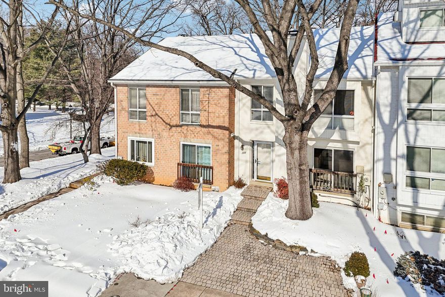 Welcome home to 7353 Broken Staff, a beautifully updated townhome in the heart of Columbia, Maryland; truly move-in ready and thoughtfully improved over the years.  This home offers the perfect blend of comfort, functionality, and location, complete with a FENCED BACKYARD ideal for pets, play, or relaxing outdoors.  Recent updates provide peace of mind and modern appeal, including fresh paint throughout most of the home (2026), a new range (2025), two new basement sliding glass doors (2025), additional attic insulation (2023), a NEW ROOF (2022), new bedroom carpeting (2022), and NEW HEAT & AIR SYSTEM (2019).  Privacy abounds here as THE HOME BACKS TO OPEN SPACE AND TREES, offering a tranquil setting with no homes directly behind.  The main level features a welcoming kitchen with a breakfast/snack bar, adjoining dining area with a built-in curio cabinet, and a charming WOOD BURNING FIREPLACE.  Gleaming HARDWOOD FLOORS enhance the living room, where two sliding glass doors lead to a spacious deck where you can enjoy morning coffee, entertaining, al-fresco dining, and star-gazing.  Upstairs, the private owner’s suite offers a generous walk-in closet and an updated full bath.  Bedrooms two and three share the hall full bathroom, providing comfortable accommodations for family or guests.  The finished walk-out basement expands the living space with a large recreation or family room featuring custom built-in shelving, plus two brand-new sliding glass doors that open to the fenced backyard.  A full bath, utility/storage room, and convenient under-stair storage complete this area.  Outdoors, enjoy both a rear patio and storage shed, along with a front patio-ideal for added outdoor enjoyment.  Ample surface parking adds everyday convenience.  Location truly sets this home apart.  WITHIN WALKING DISTANCE are the grocery store, community pool, and county library.  Just steps or a short bike ride away, Lake Elkhorn invites outdoor enthusiasts with its two-mile walking and jogging path, playground, and picnic pavilion.  Easy access to major commuter routes places The Mall in Columbia, Town Centre, the Merriweather District, shopping, dining, and entertainment just minutes away.  Come see why Columbia, Maryland is consistently recognized as ONE OF THE BEST PLACES TO LIVE-and discover why 7353 Broken Staff is the perfect place to call home.
