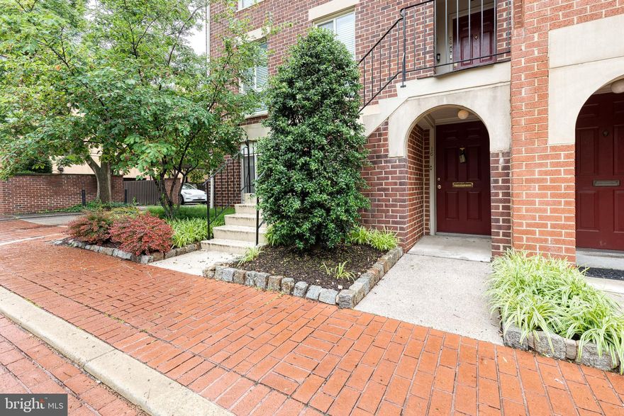 Presenting one of Otterbein's best located condos, walkable to M&T Bank Stadium, Camden Yards, and including Two parking spaces! 16 West Hill Street #R12 welcomes new owners to a cozy two bedroom, two full bedroom residence complete with wood-burning fireplace perfect for spring nights after the ballgame. Entering into the sizable living area, find hardwoods flowing from the entryway sitting area, through the dining room, and to the living room with oversized window letting natural light flow throughout. The kitchen's mini-bay window lets more natural light on ample storage and countertop space. Down the hall past the second full bathroom, two generously sized bedrooms and closet spaces are found. The primary suit has another full bathroom and two large closets. The crowning jewel is the deeded covered carport providing covered & secure guaranteed parking, accompanied by a second spot in the condo's secure parking lot!