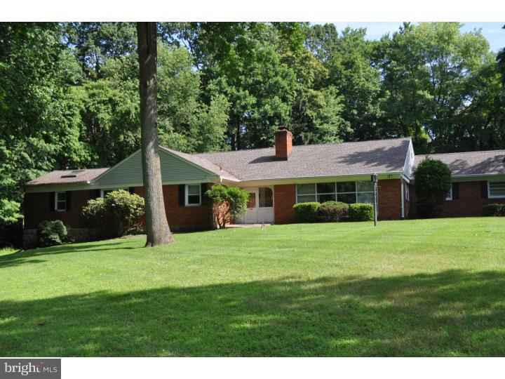 Set back far from the street, this spacious ranch home is situated on a large park-like lot in Marple Township. The spacious rooms and a flexible floor plan are fabulous for entertaining. The main level is comprised of a large Entry Foyer, Living Room with fireplace, formal Dining Room, Family Room with fireplace, eat-in Kitchen, Laundry Room, Powder Room, Master Bedroom Suite with a luxurious, large Bathroom with soaking tub and a walk-in Closet with skylights. The Master Bedroom also has a second bath with a shower stall. There are three additional large bedrooms plus a hall bath. The walkup attic is floored. The Sunroom is large and heated and overlooks the inground pool. There is a two car attached garage with overhead storage. The finished basement is enormous and ready to be styled into any number of uses such as rec room, home gym, home theater etc. This home has been well maintained and a new roof was installed in 2012, however some cosmetic updates may be desired. Great location for shopping, transportation and entertainment.