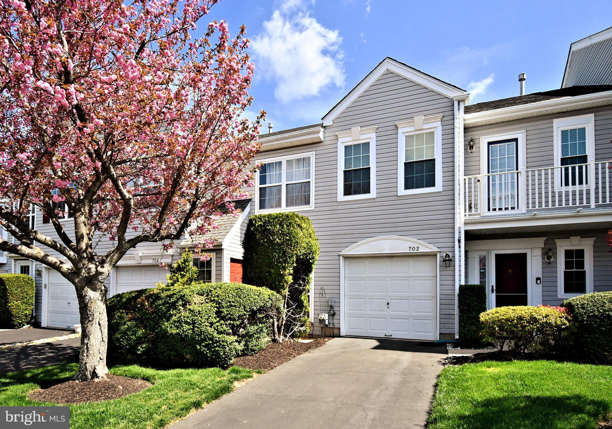 Stunning. Better than new! This is the one you have been waiting for. Pack your bags and move right in. Truly care-free living at its finest. Updated, upgraded, and upscale! Not only is it absolutely beautiful, everything has been taken care of for you.....NEW windows, HVAC, storm doors, slider, hot water heater, and all of the appliances!!! There is so much more, the spectacular Brazilian cherry wood floors, cozy wood burning fireplace, custom closets, dazzling light fixtures, sizable bedrooms, plenty of storage, 1 car garage and impressive kitchen. Words and pictures do not do it justice. You really must see it. All of this, plus located in the very desirable Montgomery Township with everything you need nearby..... tons of shopping, restaurants, entertainment, parks, gyms, walking trails, bike trails, major roadways, and public transportation. This is perfect timing, you will be in just in time to enjoy the private, neighborhood pool! Why would you want to live anywhere else?