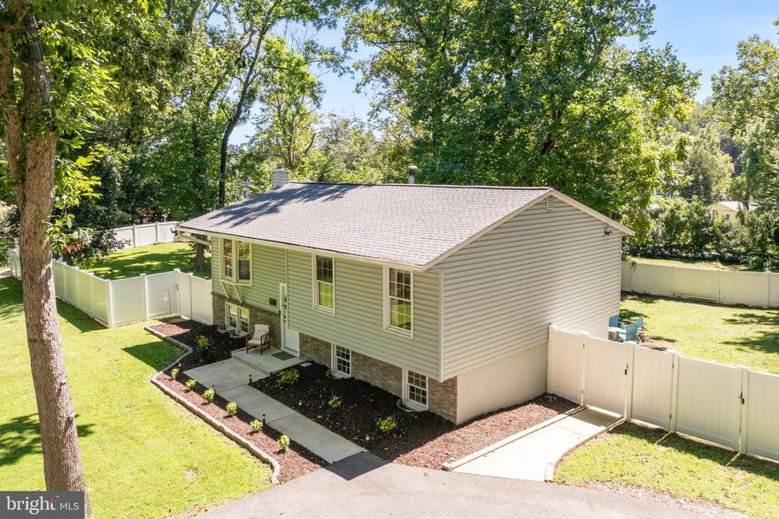 Welcome to 533 Wilson Rd, a 4-bedroom, 2-bath home located in the highly desirable Palisades community with direct water access to Round Bay. The main level offers a comfortable living area off the kitchen and access to a back deck, perfect for grilling and entertaining. The finished lower level includes two additional living areas—one ideal as a playroom, media space, or hobby room, and the other with potential for a private office or 4th bedroom. This home sits on one of the largest lots in the neighborhood, fully fenced with a  privacy fence. A unique angled back gate provides direct access to Smith’s Marina, where you can keep your boat in a slip just steps away or park your trailered boat inside your yard for convenience. As a Palisades resident, you’ll enjoy a private beach, boat ramp, pavilion, playground, and pier - a perfect spot for fishing, crabbing, or simply relaxing with views of St. Helena Island and watching the boats come in. The marina store, only steps away, makes it easy to grab ice cream, snacks, or boating essentials. 533 Wilson Rd combines easy living with the best of waterfront community life, an ideal opportunity for families, boaters, and anyone seeking a home with both comfort and lifestyle.