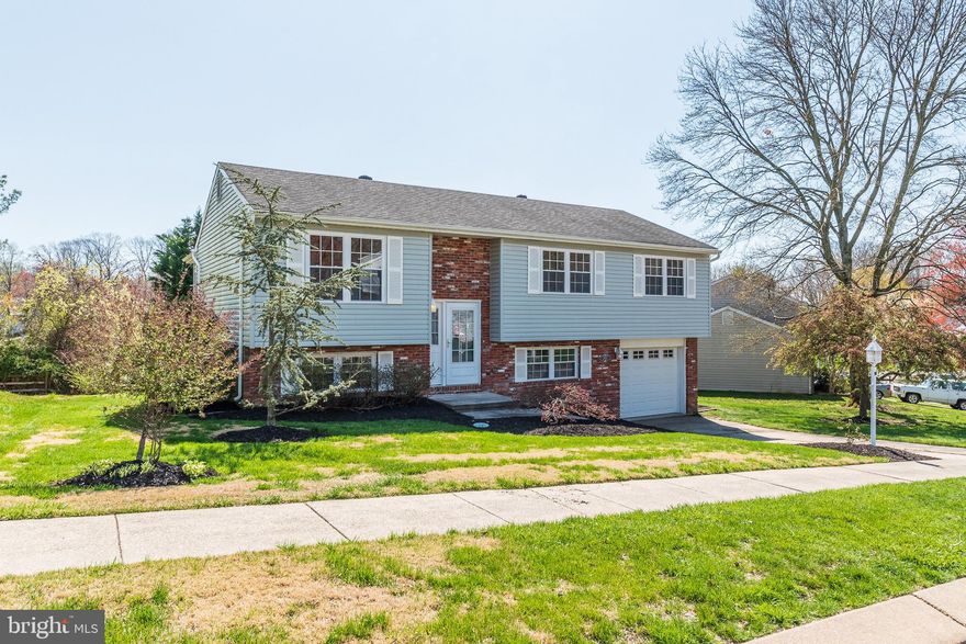 Beautiful, updated 4 BR, 2 Bath home with enclosed  3 season room off Dining Room, Maintenance free Vinyl Siding, covered stamped concrete patio, Lovely private rear yard, One car garage.  Updates approx 2010...roof..heat pump. & windows. Front load heavy duty washer/dryer. This Year-new paint..new carpet..new kitchen flooring and counter tops..new sink and garbage disposal., new chandeliers in dining room and foyer...New Steel Entry Door w/Sidelights...New Garage Door. Ceiling fan in kitchen.  Blinds in bedrooms......level lot with walkout.. with weeping cherry tree in front..azaleas and rhododendrons too!SEE VIDEO TOUR, CLICK ON VIDEO CAMERA ICON.