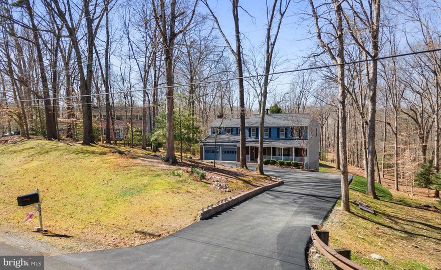Winning combination of home, lot and location!  Inviting home full of charm and character sited on a private 1.93 acre lot.   Site offers wooded views yet has ample lawn area ideal for kids play.  Great home for family living and entertaining.   Nearly 2500 sf above grade of living space plus an additional 896 unfinished walk out basement ready to finish to your preference.  Inviting front porch entry to foyer and main level.  Main level offers living room, dining room, powder room, eat in kitchen and family room.  Upper level offers 4 spacious bedrooms & a bonus room to include a beautiful primary bedroom suite,  en-suite bedroom with bath, and 2 more bedrooms, hall bath,  plus a flex room  that current owners uses as a home office.  Laundry located on bedroom level and tucked discreetly in flex room.  Entertain in style with deck,  heated pool, generous pool surround all fenced plus huge back lawn.  Some of the numerous recent improvements include roof 2023, interior & exterior paint 2023, carpet 2023,  hot water heater 2023.  Conveniently located minutes from the Prince William County parkway.