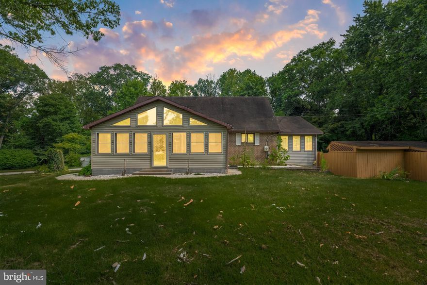 NEW Price, NEW roof, NEW septic tank! Tucked away on 1.68 private, wooded acres in the peaceful Potomac Heights community, this custom-built contemporary-style home offers a great mix of space, comfort, and style. Natural light and wood accents fill the home, creating a warm and welcoming vibe throughout. With 2,716 square feet of finished living space, there’s plenty of room to spread out. The updated kitchen features oak cabinets, tile backsplash, stainless steel appliances, new quartz countertops, a breakfast bar, a self-cleaning electric oven, built-in microwave, a pantry with pullout drawers, and a dishwasher to make everyday life easier. Bring the picnic table and patio furniture because off the kitchen is a huge fully screened sunroom. The living room is large and steps down through glass pocket doors to a generous sized dining room with a vaulted ceiling.  The second floor is where you’ll find the primary bedroom with an exterior balcony, a full bath, and a loft area making it a perfect owner’s suite.  There’s also a main level bedroom and an additional room that could make the third bedroom or home office. The main level bathroom accommodates the laundry, and the washer & dryer convey.  Downstairs, the fully finished basement creates yet another flexible living area. The basement-level 2-car garage backs to a utility room with an abundance of space for storage or a potential workshop.  There’s also a detached two car garage for the car enthusiast which also has a huge loft.  The fenced backyard provides a fire pit, a deck, and a covered seating area to enjoy grilling, breezy summer evenings, and it would be a great space for a hot tub!  There’s a shed/chicken coop on the property too!  There is a lot to see and love here. River access is private to the community and can be located at the locked gate on Lockhouse Rd. Minutes to I-81 and shopping. Schedule your showing today!