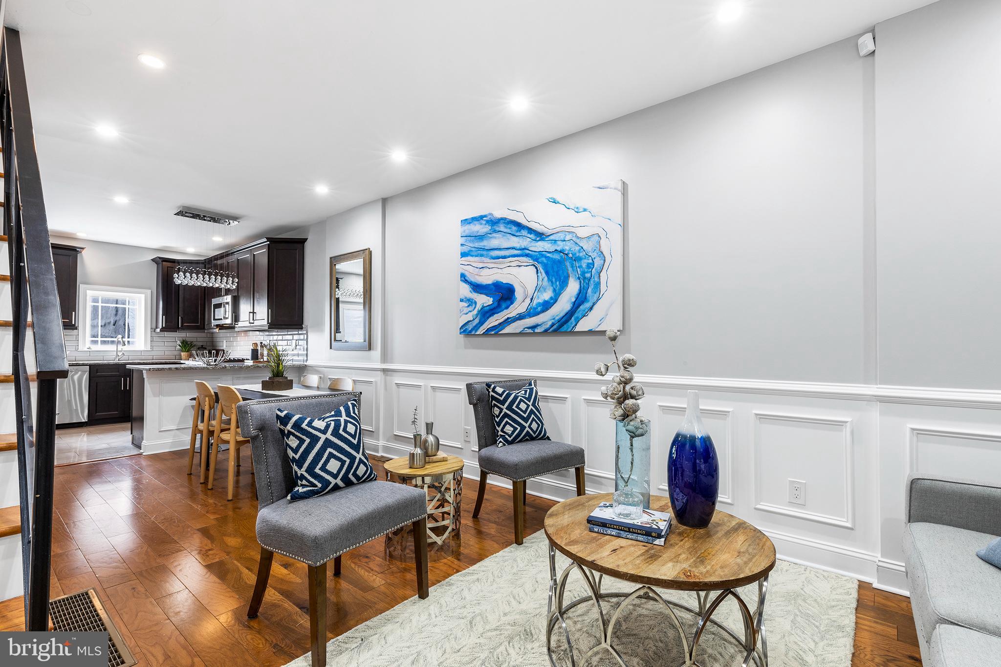 Step into this masterfully renovated residence in Fishtown- a true gem, meticulously designed for the ultimate in comfort and style. As you enter, this thoughtfully designed open living space features high ceilings and elegant hardwood floors and molding. Past a space for dining, the kitchen boasts stainless steel appliances (even a wine fridge for the aficionados), granite countertops, and chic wooden cabinetry.
Entertaining? The fully finished basement is your playground, complete with a stylish bar area, cozy fireplace, and a convenient powder room. Upstairs, two spacious bedrooms and a sleek bathroom await, along with your own private balcony oasis.
Now, let's talk about the pièce de résistance - the third-floor master suite. This sanctuary boasts a sprawling bedroom, an indulgent bath with a soaking tub and rejuvenating shower, and yet another private balcony for those quiet moments.
But it doesn't stop there. Ascend to your private rooftop deck and be prepared to have your breath taken away. The 360-degree views are simply jaw-dropping, showcasing the city skyline and iconic Ben Franklin Bridge. 
Crafted with meticulous attention to detail, this renovated residence (2018)  is a testament to quality craftsmanship. Schedule your private tour today of this exceptional home.