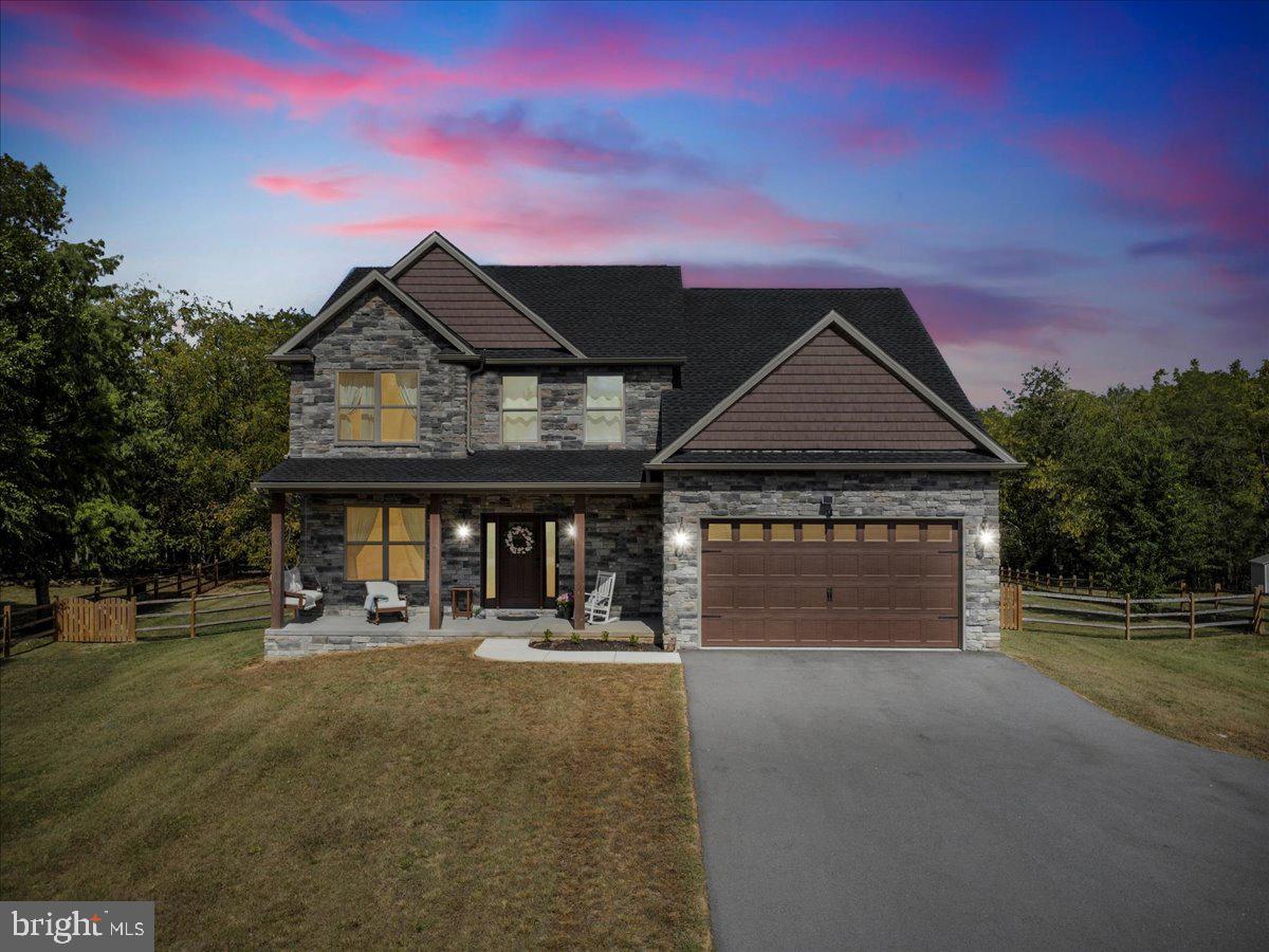 Welcome to 2428 Pikeside Drive — a custom-built craftsman-style home that blends modern luxury with timeless design. Built just over a year ago, this 5-bedroom, 2.5-bath residence offers nearly new construction with thoughtful upgrades throughout, all set on a spacious 0.75-acre lot in a quiet and desirable Greencastle location…. The upper level is home to four bedrooms, including a spacious primary suite featuring two walk-in closets and a spa-like ensuite with double sinks and quartz counters. Three additional spacious bedrooms, another full bathroom, and the conveniently located laundry room complete this floor…. On the main level, a welcoming foyer opens to a formal dining room with elegant wainscoting, perfect for hosting. The heart of the home is the gourmet kitchen, showcasing quartz countertops, a marble backsplash, stainless steel appliances, and the gold hardware makes it all pop. The kitchen flows seamlessly into the living room, where a propane fireplace creates a warm gathering space. Step outside to enjoy the covered patio and fenced backyard—ideal for entertaining or relaxing outdoors. A half bathroom is also on this level for added convenience…. The fully finished lower level expands your living space with a large recreation room and a 5th bedroom, offering endless versatility. Flooring includes engineered wood on the main level, ceramic tile in upper level hall bathroom, marble tile in the primary bathroom, and upgraded carpet in the bedrooms and the lower level…. Built with quality in mind, this home features 2x6 exterior wall construction for added durability and efficiency, plus a full water treatment system… Located in a peaceful setting with easy access to commuter routes, 2428 Pikeside Drive is the perfect blend of craftsmanship, comfort, elegance, and convenience…. Don’t miss your opportunity to own this beautiful custom home—schedule your private tour today!