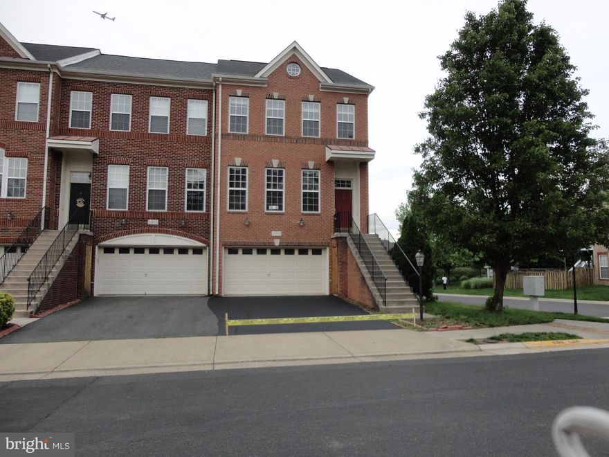 Move in Ready ..Stunning end-unit 3-level townhome with 2-car garage available for rent in the sought-after, amenity-rich Stone Ridge Community. Offering over 2,150+ sqft of living space, this home features 3 bedrooms, 3 full baths, 1 half bath, and gleaming hardwood floors throughout. Fresh New Coat of Designer paint being done. The open floor plan includes a gourmet kitchen that walks out to a brand-new Trex deck, a spacious master suite with walk-in closets and a luxury bath, and a fully finished basement with a rec room, full bath, and walkout to a fully fenced backyard. Enjoy access to multiple pools, tennis courts, fitness center, clubhouse, walking trails, playgrounds, and tot lots. Conveniently located within walking distance to the Gum Spring Library, shopping plaza, and Park & Ride with direct service to DC, and just minutes to the Metro, Stone Springs Hospital, major routes (50 & 606), and shopping at Harris Teeter, Walmart, Target, Costco, and Dulles Landing. Plenty of visitor parking behind the home. Pets on Case by Case Basis