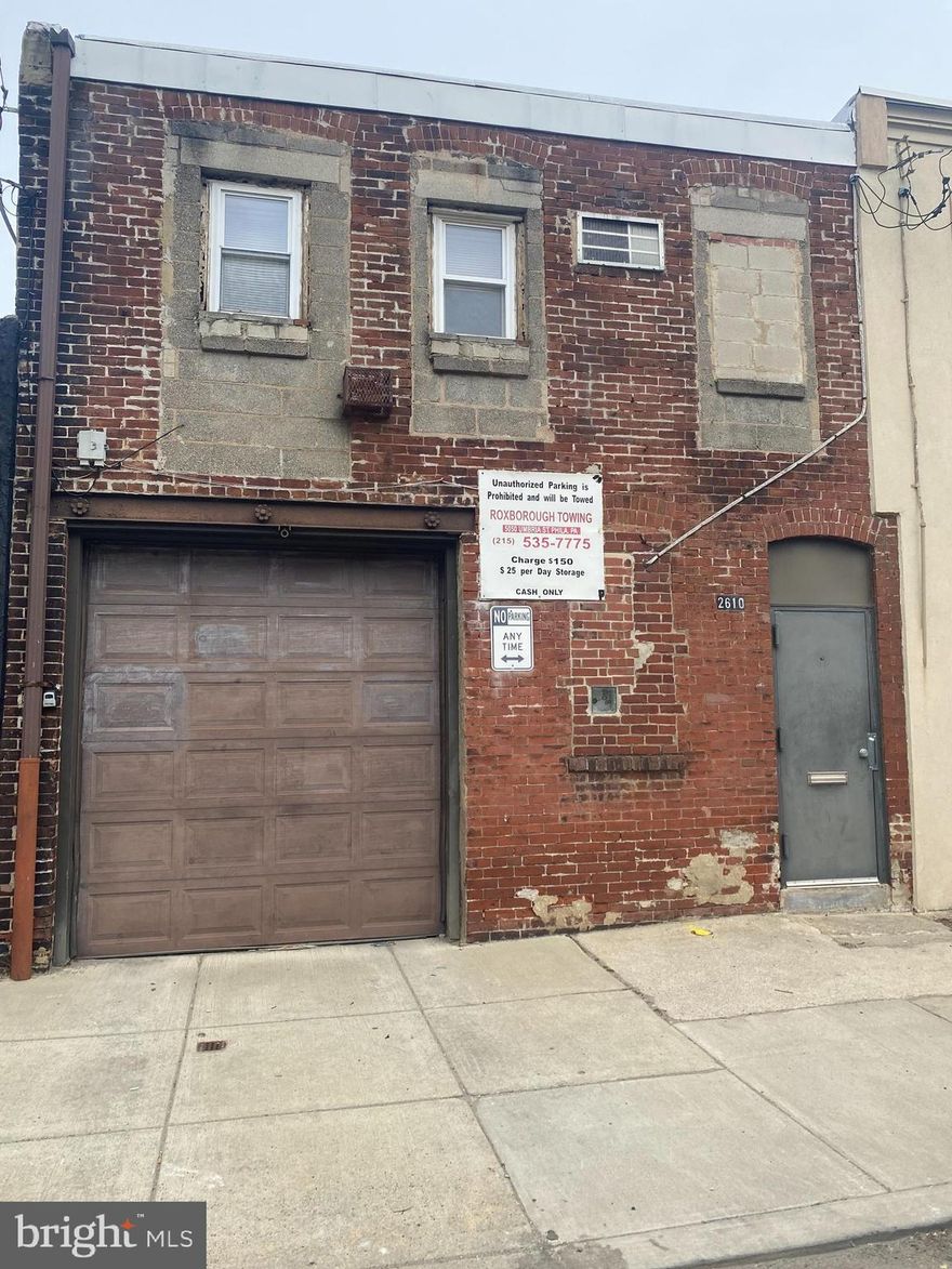 Rare mixed-use opportunity in the highly sought-after 19125 zip code! This property has CMX2 zoning and is currently being used for residential purposes. The first floor features a spacious garage with enough room to fit one to two automobiles, complete with overhead lighting, an electric garage door opener, exposed plumbing, and a stationary tub. Head upstairs to find a comfortable living space with a kitchen, one bedroom, and one bathroom. The bedroom leads to a convenient laundry area with a washer and dryer, as well as the water heater and heating system. Don't miss out on the chance to own this versatile property with endless potential!
