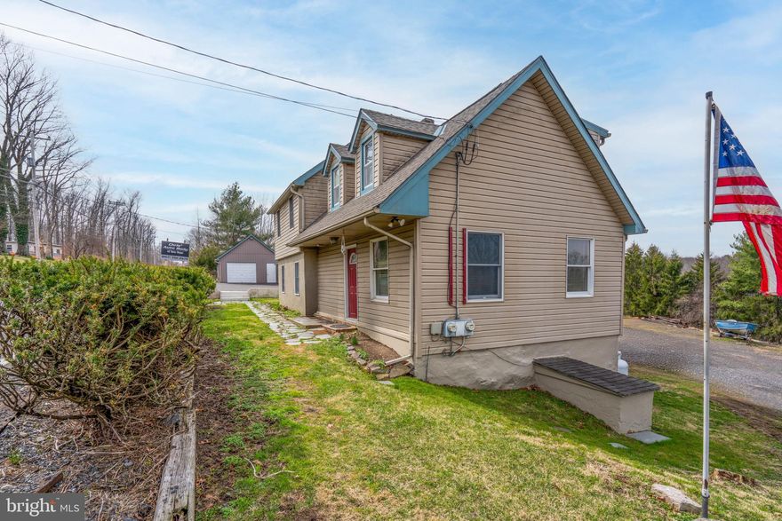 This exceptional property, originally built in 1940 and recently renovated in 2025, presents a unique investment opportunity. There is a duplex, one unit with 3 bedrooms, 2 and a half baths and one with one bedroom and one bath. The three bedroom unit is vacant and renovated in 2025. There is a large basement area for both units. Outdoor features include a deck and patio overlooking open space and woods, perfect for entertaining or relaxing in nature. Situated on a generous 1.22-acre lot, the property boasts a serene backdrop of trees and woods, providing a tranquil setting while still offering convenient road frontage.  Investors will appreciate the additional structures on the property, including a 2nd garage and ample parking options with space for up to 15 vehicles. The oversized garage, spanning 1,750 sq ft, has operated as a successful auto body shop for decades. Please note that the business itself is not being offered with the sale of the property. The garage has room for six vehicles, a break room, paint mixing room and paint booth, along with bathroom for staff. There is an office with bathroom for customers that was renovated in 2025. There is an expansive attic space above the garage for storage. Another two car garage provides more storage and parking space. There is parking in front of the business for four to five vehicles, and additional parking in the rear for at least 10 to 12 more vehicles. Located less than one mile from the heart of New Hope Borough, this is the perfect investment opportunity. As a well-established location, this property would be perfect for an owner-operator or a savvy investor interested in growing their portfolio.