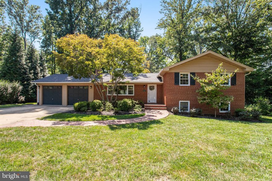 ***OFFER DEADLINE, MONDAY AUG 28 @ 5PM*** Yacht Haven Estates gem! This 4 level home with  4 bedrooms and 3 full baths and over 3300 sq ft of living space, was beautifully updated in  2019. The home lies on 0.61 of an acre with lovely tall trees providing a nice canopy. As you walk in the front door you are greeted with a large family room with wood burning fireplace and hardwood floors. The kitchen was updated in 2019 with white quartz counter tops, grey and white tiled backsplash, stainless steel appliances and large peninsula with seating. The dining area is open to the kitchen and the living room for great open concept living. There is also a large office/playroom off the dining room with a great view of the backyard. Upstairs are three good sized bedrooms. The primary bedroom has a completely updated primary bath and custom closet. Heading down to the large rec room with walkout to the backyard, you can enjoy great leisure time around the wet bar and wood burning fireplace in the bright family room. There is also a large bedroom on this level and full bath. Great for hosting guests. The second lower level is a wonderful bonus space for playroom, home theatre or work out space. Also located on this level is spacious laundry area and TONS of storage. This house also features an extra wide driveway and large two bay garage. In side the garage this is added space with a second washer and dryer and extra fridge. The roof and water heater (now tankless) were replaced in 2019, and the HVAC in 2016. The back yard is flat, fully fenced (new 2019) for privacy and has lots of beautiful tall tree for shade yet tons of open space to play. There is a patio and deck for your entertaining and relaxing needs. As a resident of Yacht Haven Estates you have access to Yacht Haven Marina with 119 boat slips, swimming pool and community center for an annual fee of $1,500 per year. What a deal! Yacht Haven is tucked in Mount Vernon just down from George Washington's estate on the Potomac River. Just 20 minutes down the parkway from Old Town. Within a few miles there is the Mount Vernon Country Club, George Washington Swim Center, Fort Belvoir, Wegman's and Express buses to the Metro, Old Town and DC. Sorry for the wait, but it will be worth it! See you August 24th.