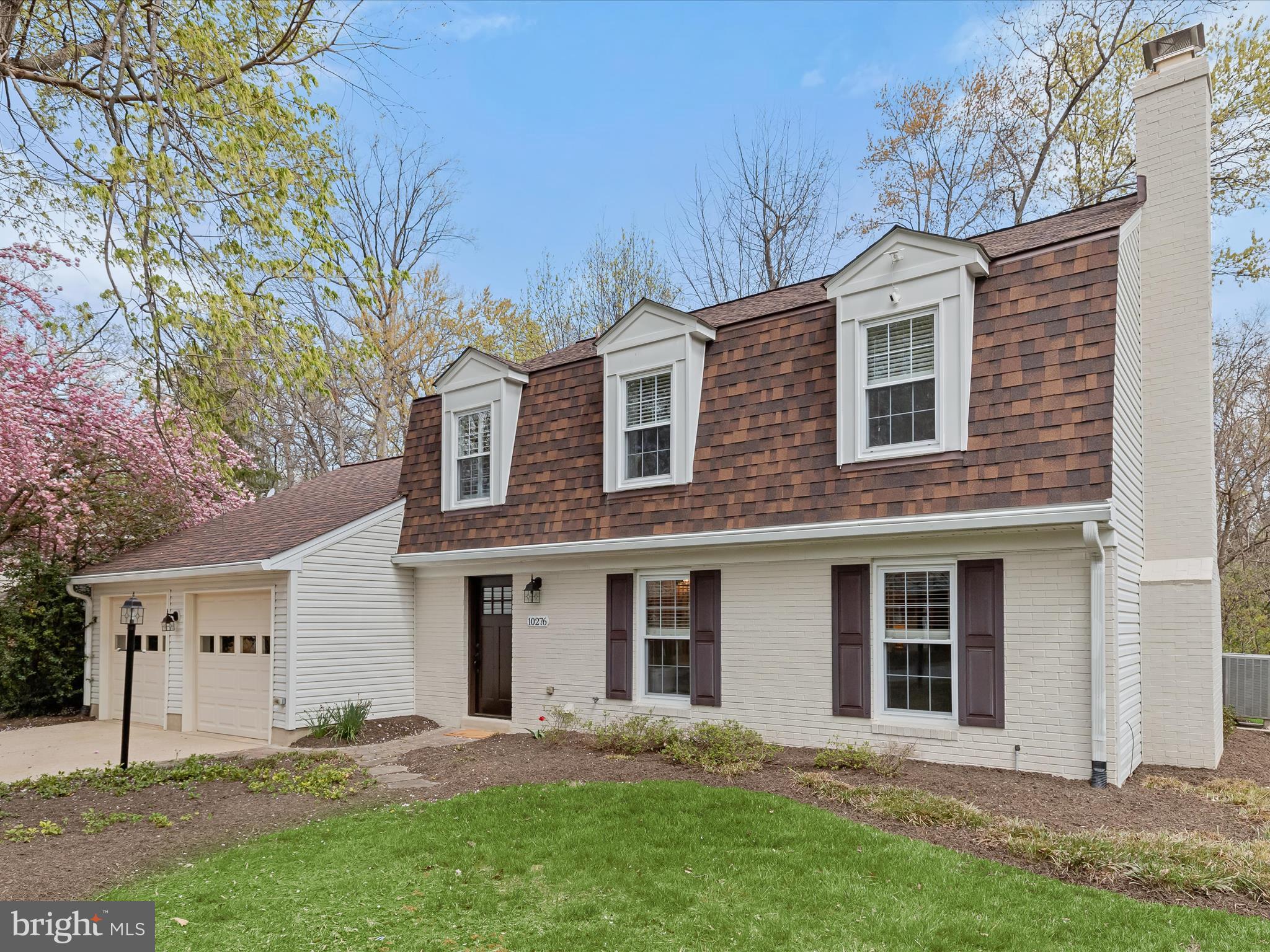 Beautiful brick-front colonial offers 4 bedrooms, 2.5 bathrooms, and a host of stylish updates throughout, all nestled in the sought-after Village of King's Contrivance Columbia community. Major updates include a remodeled kitchen and baths, and the roof (2017). The main level features gleaming hardwood floors in the living and dining rooms, while the renovated kitchen boasts granite countertops, a custom tile backsplash, and stainless steel appliances, and adjoins the family room. Enjoy year-round relaxation in the enclosed porch with rich mahogany flooring. A convenient powder room and laundry area complete the main level. Upstairs, the spacious primary suite features a luxuriously renovated bath with a glass-enclosed shower and custom tilework. Three additional bedrooms and an hall bath offer ample space for family or guests. Backed by serene woods with access to nearby hiking trails, this home provides a perfect balance of privacy and convenience. Located just minutes from major commuter access routes 32 and 29, offering easy access to Columbia’s endless dining, shopping, and entertainment options.