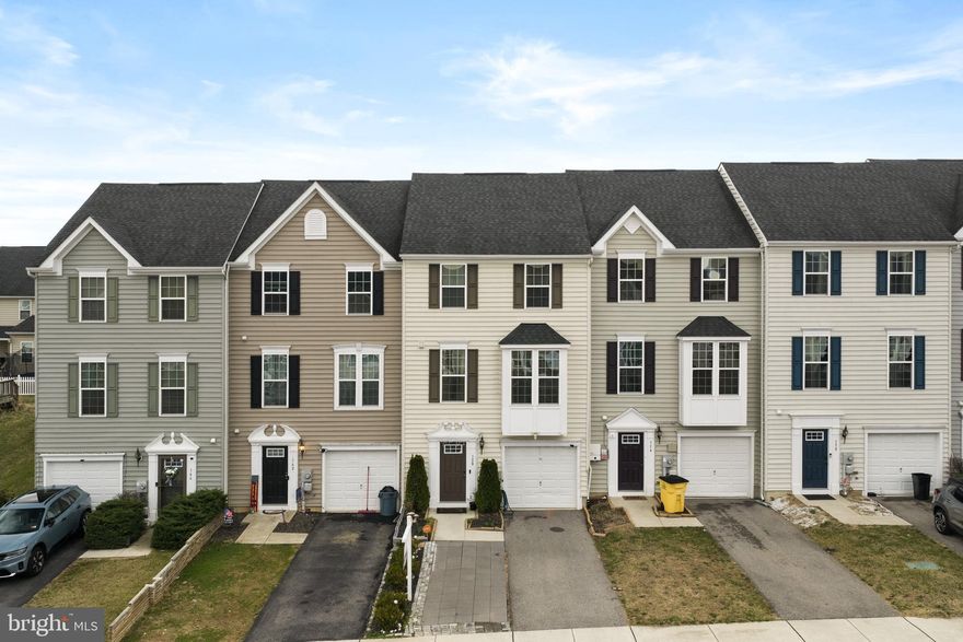 ooking for space without the price tag of a single-family home? This rare 4-bedroom townhome at 158 Norwood Drive in beautiful Falling Waters, WV offers the room and flexibility many buyers are searching for. Built in 2016, this home features 4 bedrooms, 3 full bathrooms, and 1 half bath, with the added convenience of a bathroom on every level of the home. The entry level welcomes you with access to the spacious garage and a large fourth bedroom complete with an egress window, walk-in closet, and en suite bathroom with a shower. This space also offers flexibility and could easily serve as a second family room, recreation room, or guest suite. The main level features an open-concept kitchen with real hardwood floors, a large center island and peninsula, stainless steel appliances, a spacious pantry, and a dining area with a sliding glass door that leads to the fully fenced backyard. Just off the kitchen is a comfortable family room equipped with surround sound, creating a great space for everyday living or entertaining guests. Upstairs, the primary suite includes a walk-in closet and an en suite bathroom with dual vanities and a walk-in shower. Two additional bedrooms, another full bathroom, and a conveniently located laundry area complete the upper level. Step outside to enjoy the fully fenced backyard with a patio, perfect for pets to roam, kids to play, or relaxing evenings with friends and family. Conveniently located near I-81, shopping, restaurants, medical offices, and schools, this home offers a great balance of convenience and peaceful living. Schedule your showing today and come see everything this home has to offer.