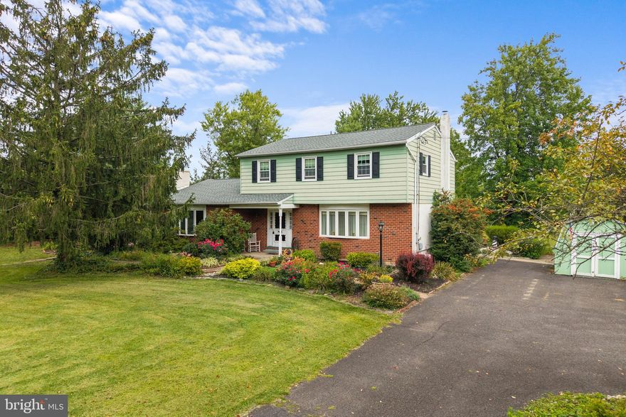 Nestled on nearly 2.5 acres of private property in beautiful Bucks County, this exceptional home has much to offer!  Step inside the welcoming foyer that leads you into the heart of the home. French doors and a large bay window fill the formal living room with natural light, creating a bright and inviting space. The living room seamlessly connects to the formal dining room, making it ideal for hosting dinner parties.  The chef's kitchen features a range-top stove, a built-in raised oven, and a dedicated microwave nook. An adjacent breakfast area provides a casual spot for morning coffee. This space flows effortlessly into the Great Room, which serves as the home's centerpiece. Here, a cozy fireplace and striking beam ceilings create a warm and rustic atmosphere perfect for relaxing.  The outdoor space is a true retreat. A large patio extends off the Great Room,  offering a perfect spot to enjoy the peaceful, wooded surroundings.  A new roof was installed in 2022.  This property provides the perfect opportunity to enjoy the serene beauty of Bucks County while staying close to everything you need.