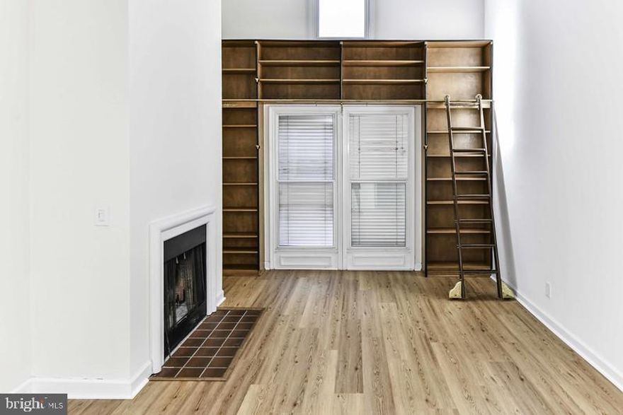 Light filled 2 story, 1BR, 1BA loft in historic Torpedo Factory in Old Town, Alexandria*This condo is an architectural gem in heart of Old Town*Spacious, inviting, bright & open*Living room features hardwood floors & decorative-only fireplace*Ultimate in convenience, with an array of restaurants, shops & entertainment*Enjoy vibrant lifestyle this location offers, with the waterfront just a stone's throw away, inviting you to enjoy walks along the scenic Potomac River*Only 1 pet under 40 lbs*