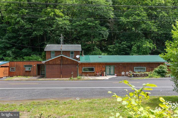 What a great multi-use property ! Almost 3000 finished sq ft offering a wonderful opportunity to live were you work ! Main house features 2 bedrooms, 1 bath and there is 1/1 efficiency apartment that could be used as an in-law suite or rented out for additional income ! Property features a frontage on US rt 50 just west of Romney WV ,the county seat in beautiful Hampshire co WV with a high traffic count and has been used in the past for various commercial enterprises . The land also is on both sides of Rt 50 and fronts a a nice stocked stream so you can fish where you live ! Currently used as a residence but the possibilities are endless for this great offering so make your appointment today to see this one of a kind gem !