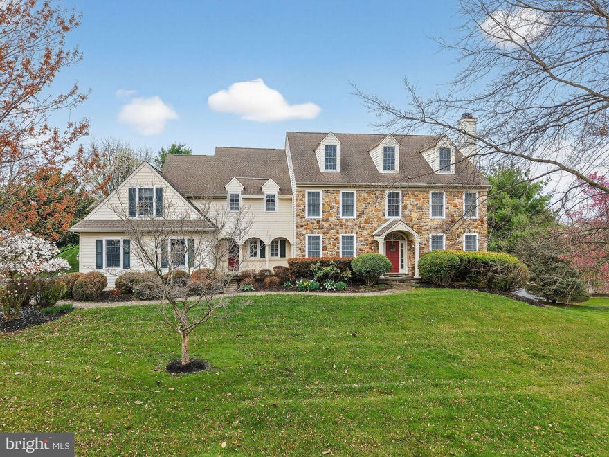 Welcome to a stunning home in the highly sought-after Olmsted community, perfectly positioned within the award-winning Unionville-Chadds Ford School District. From the moment you step inside, you’re greeted by a grand two-story foyer and extensive, gleaming site-finished hardwood floors that flow seamlessly throughout the main level—setting the tone for the elegance that unfolds. The formal living room with a gas fireplace and the gracious dining room create the perfect setting for refined entertaining. At the heart of the home, a gourmet white island kitchen with breakfast area opens effortlessly to a light-filled sunroom and an expansive family room anchored by a dramatic fieldstone fireplace—an ideal space for both everyday living and memorable gatherings.  A private first-floor office with custom built-ins offers the perfect work-from-home retreat, while a walk-in pantry, powder room, and laundry room complete the main level with both style and functionality. Upstairs, retreat to the luxurious primary suite, featuring a tray ceiling, inviting sitting room, two walk-in closets, and a spacious spa-like bath. A well-appointed en-suite bedroom creates a perfect princess/prince suite, while two additional bedrooms share a hall bath. A fifth bedroom with an oversized sitting area or playroom offers incredible flexibility for today’s lifestyle.  Plenty of storage space or future expansion is available in the walk-up attic! Quality construction is evident throughout. The unfinished walk-out lower level presents endless possibilities—ready to be transformed into your dream space. Set against breathtaking rear views and ideally located just minutes from the vibrant shops and restaurants of West Chester Borough, as well as major routes for easy commuting, this exceptional home offers the perfect blend of luxury, comfort, and convenience. This is the one you’ve been waiting for—schedule your private showing today.