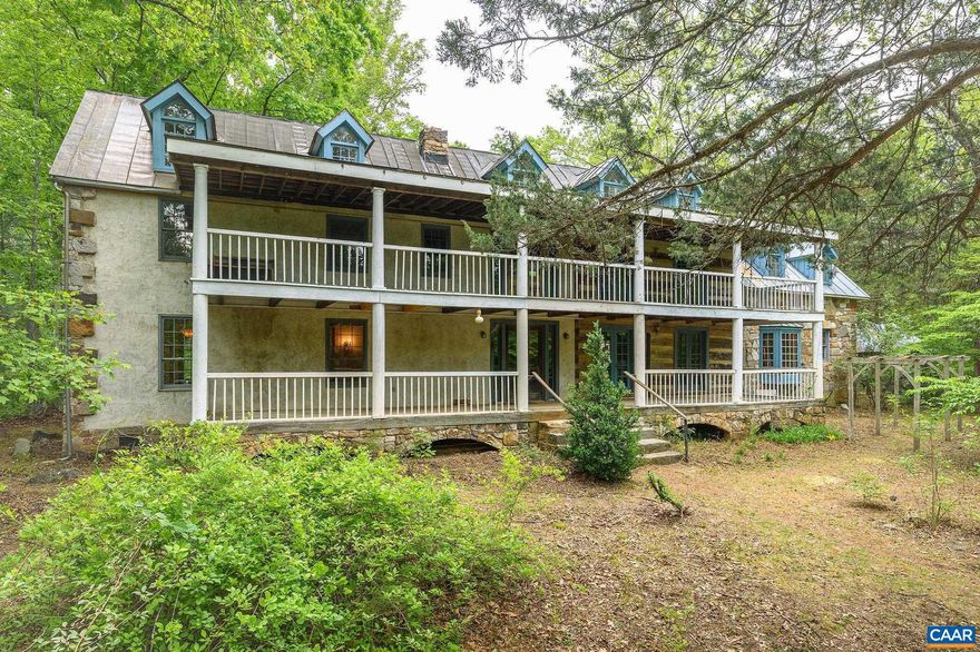 MOTIVATED SELLER! Reduced $210,000. Raven Oak is a rare combination of craftsmanship, history, space, privacy & hidden discoveries built by local builder/craftsman, Charles McRaven. This is McRaven?s hand-crafted, one-of-a kind, home place. With seamlessly married the reclaimed features with the newer parts of the build during construction- 2 hewn log sections & 2 timberframe sections. Much of the structural and finish material is of historic recycled heart pine, chestnut, & heart poplar w/ the majority of timbers and logs in the house from structures dating from the 1700s and 1800s.  It includes beautiful, INTRICATE STONEWORK constructed with local granite & West Virginia sandstone-there are 2 fireplaces & full chimneys, a notable massive Russian fireplace which heats a large portion of the home, beautiful exterior stonework framing both ends of the house. The kitchen cabinetry of rare American chestnut, copper panels & counter tops, as well as heart pine shelving. On the grounds there are native plantings galore. There are 9 outbuildings including a log chapel that seats 40 people down by the stream. Two additional building rights.  17 beautifully wooded & private acres only 10 mins to the Cville Airport & 23 mins to Cville/UVA.,Granite Counter